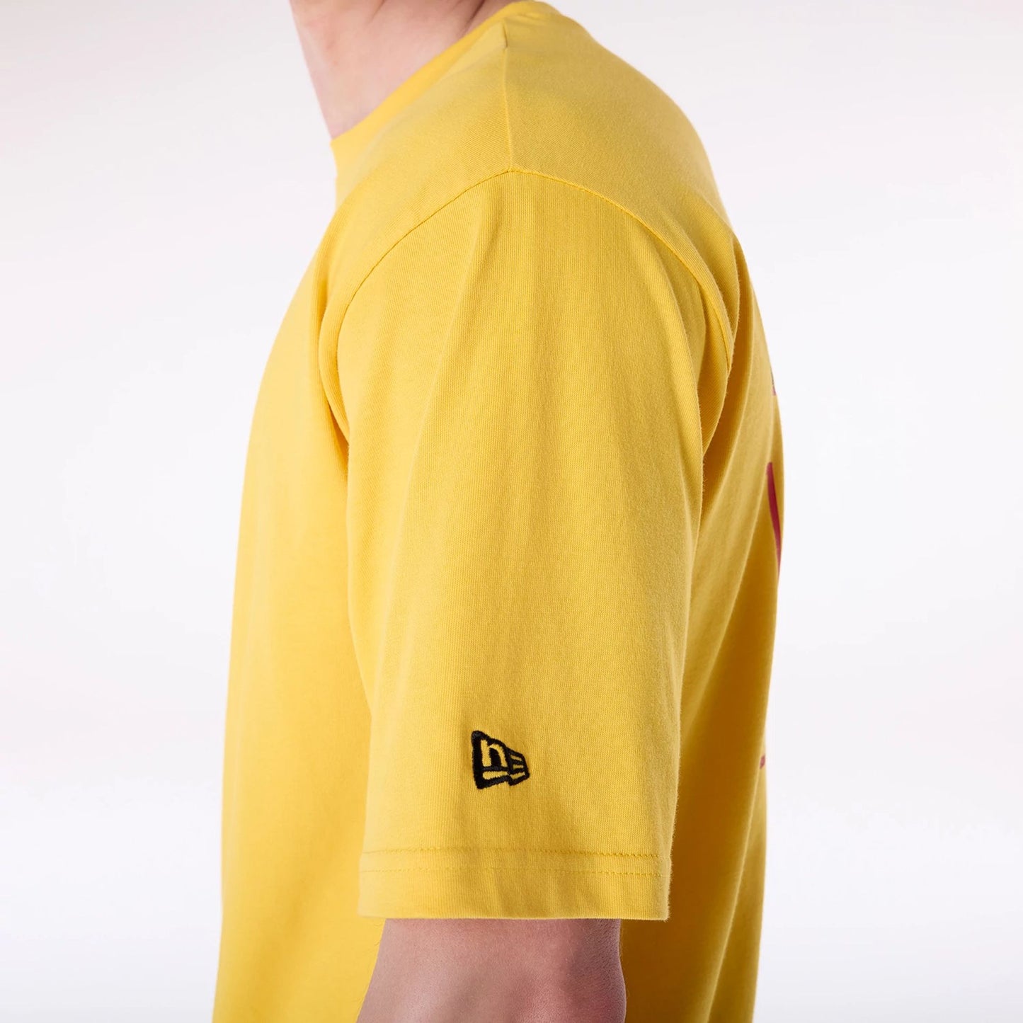 The Male model is wearing New Era Baseball Graphic Yellow Oversized T-Shirt 6