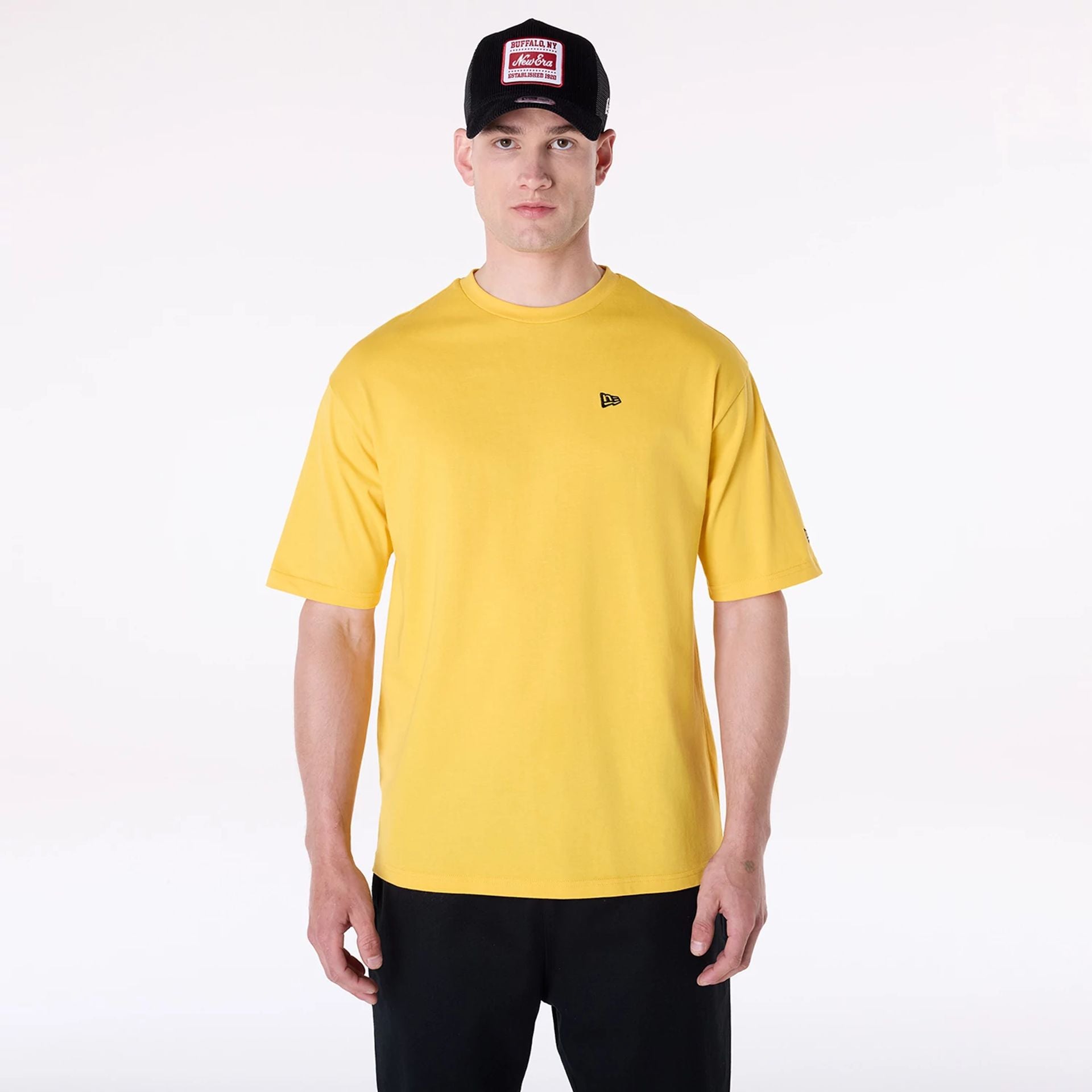 The Male model is wearing New Era Baseball Graphic Yellow Oversized T-Shirt 1