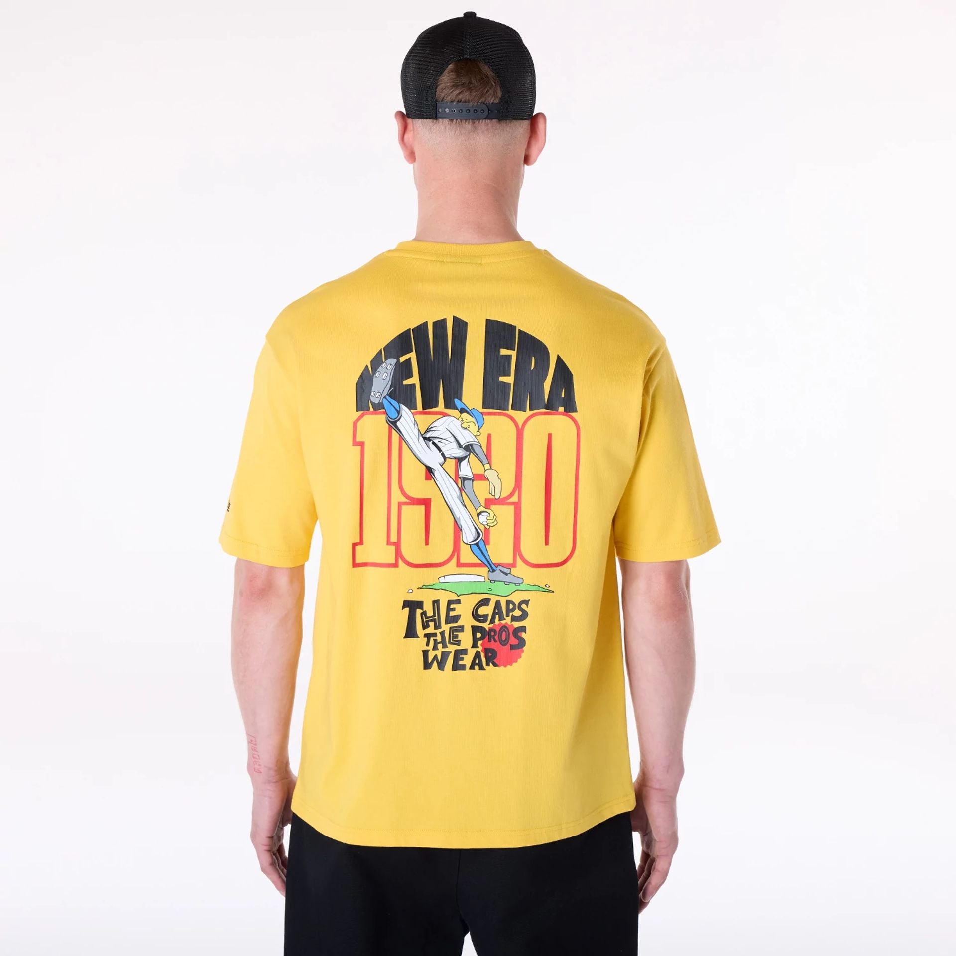 The Male model is wearing New Era Baseball Graphic Yellow Oversized T-Shirt 2