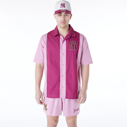 The Male model is wearing New York Yankees Stripe Revere Dark Pink Short Sleeve Shirt 1