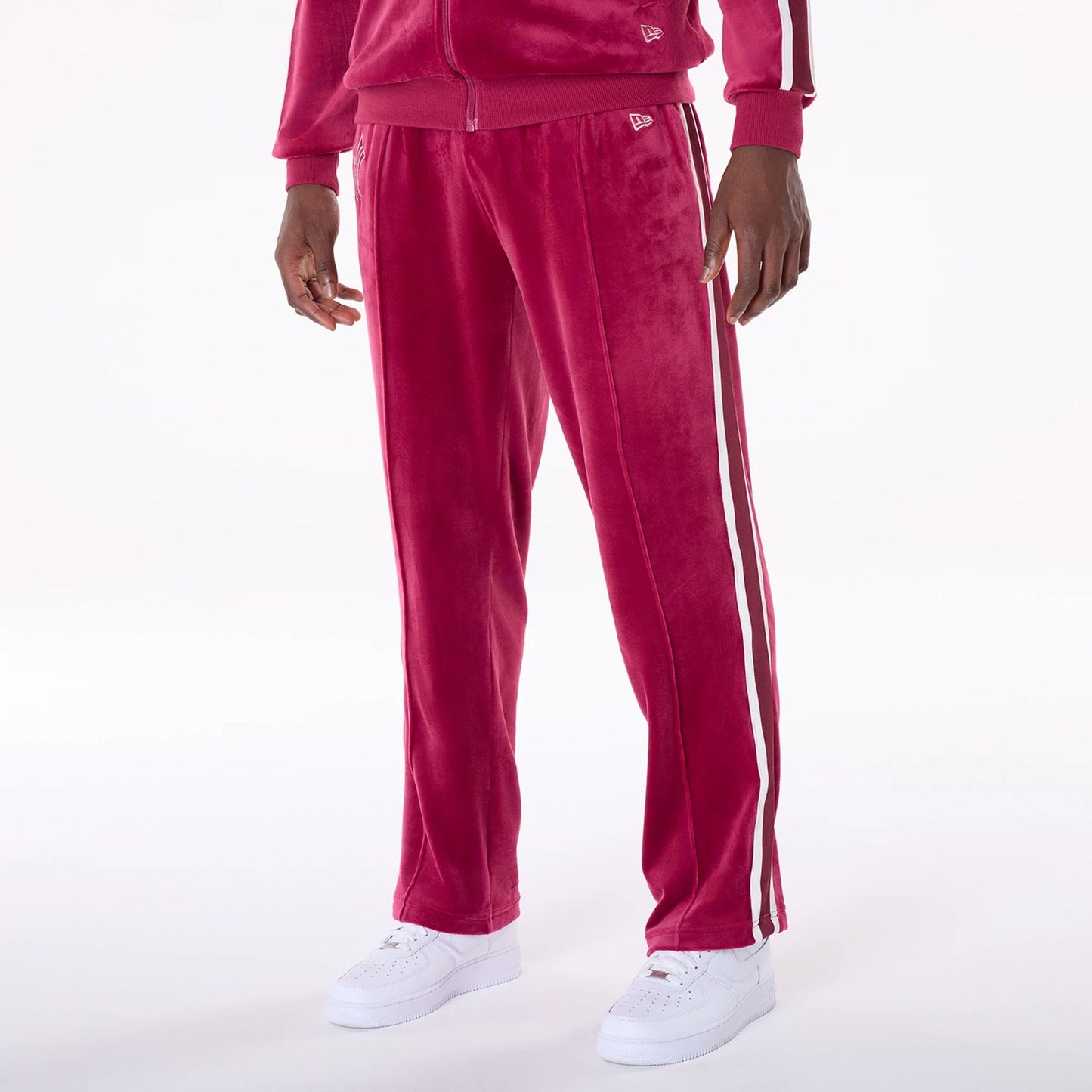 The Male model is wearing New York Yankees MLB Velour Dark Red Joggers 3