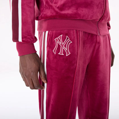 The Male model is wearing New York Yankees MLB Velour Dark Red Joggers 8