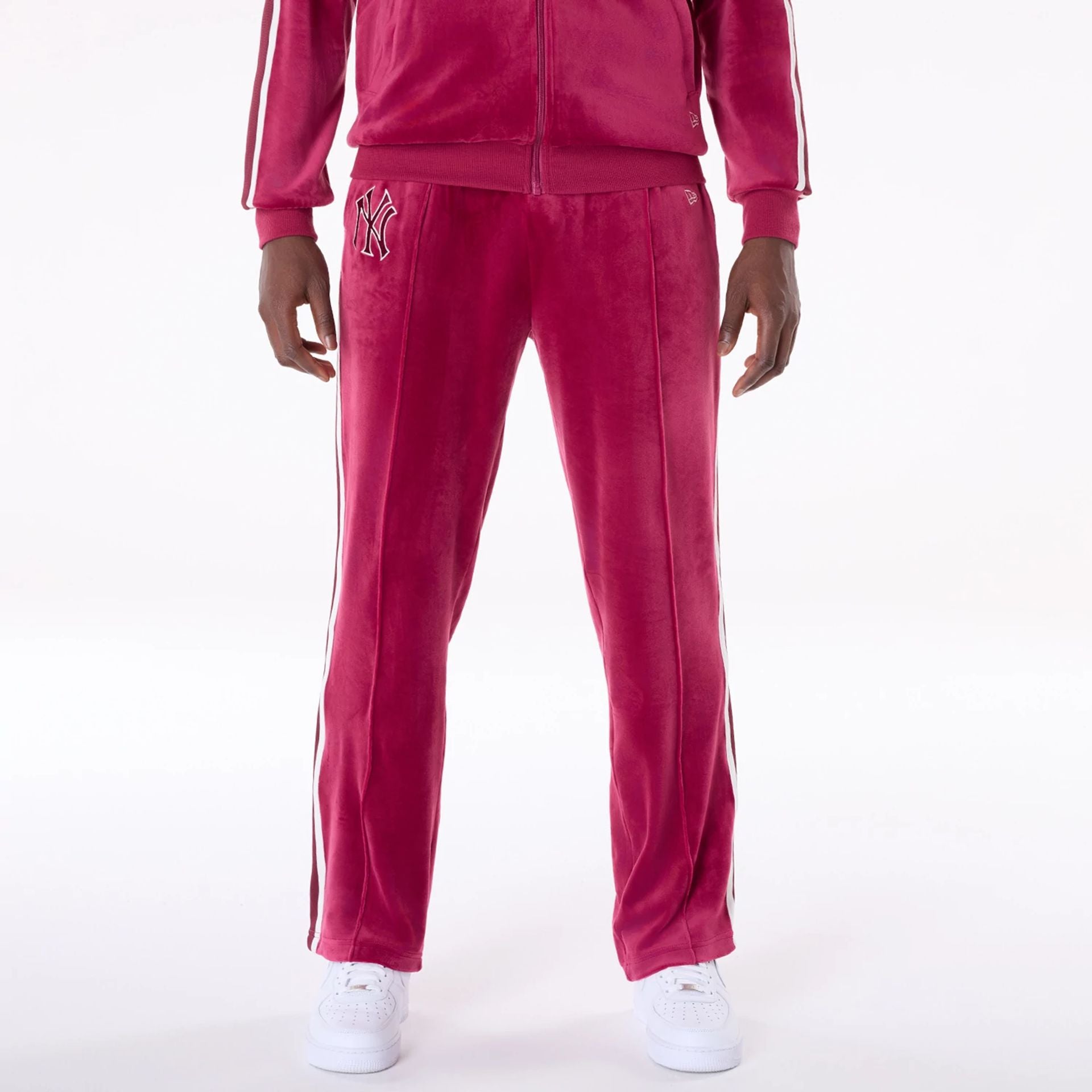 The Male model is wearing New York Yankees MLB Velour Dark Red Joggers 1