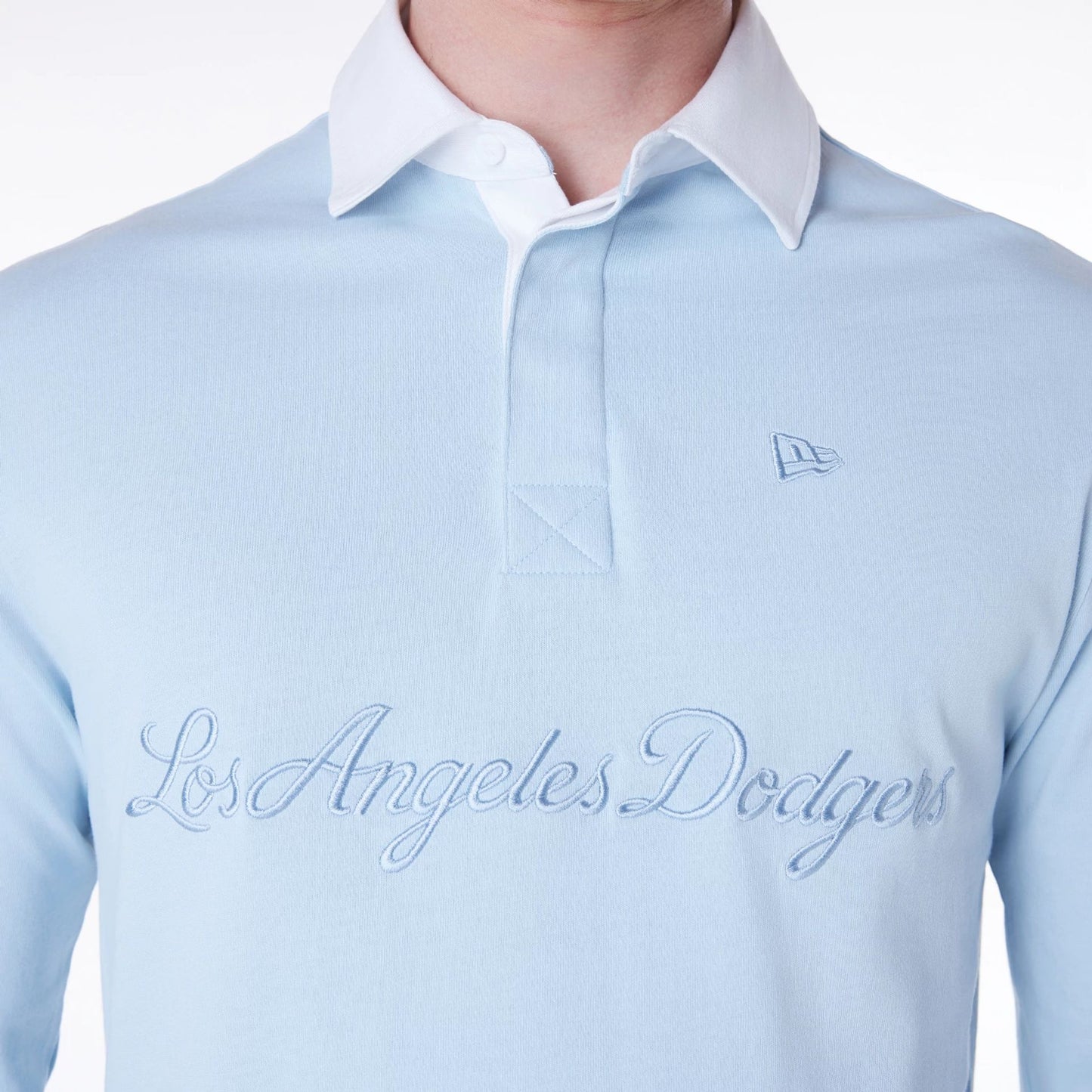 The Male model is wearing LA Dodgers MLB Script Pastel Blue Long Sleeve Polo 7