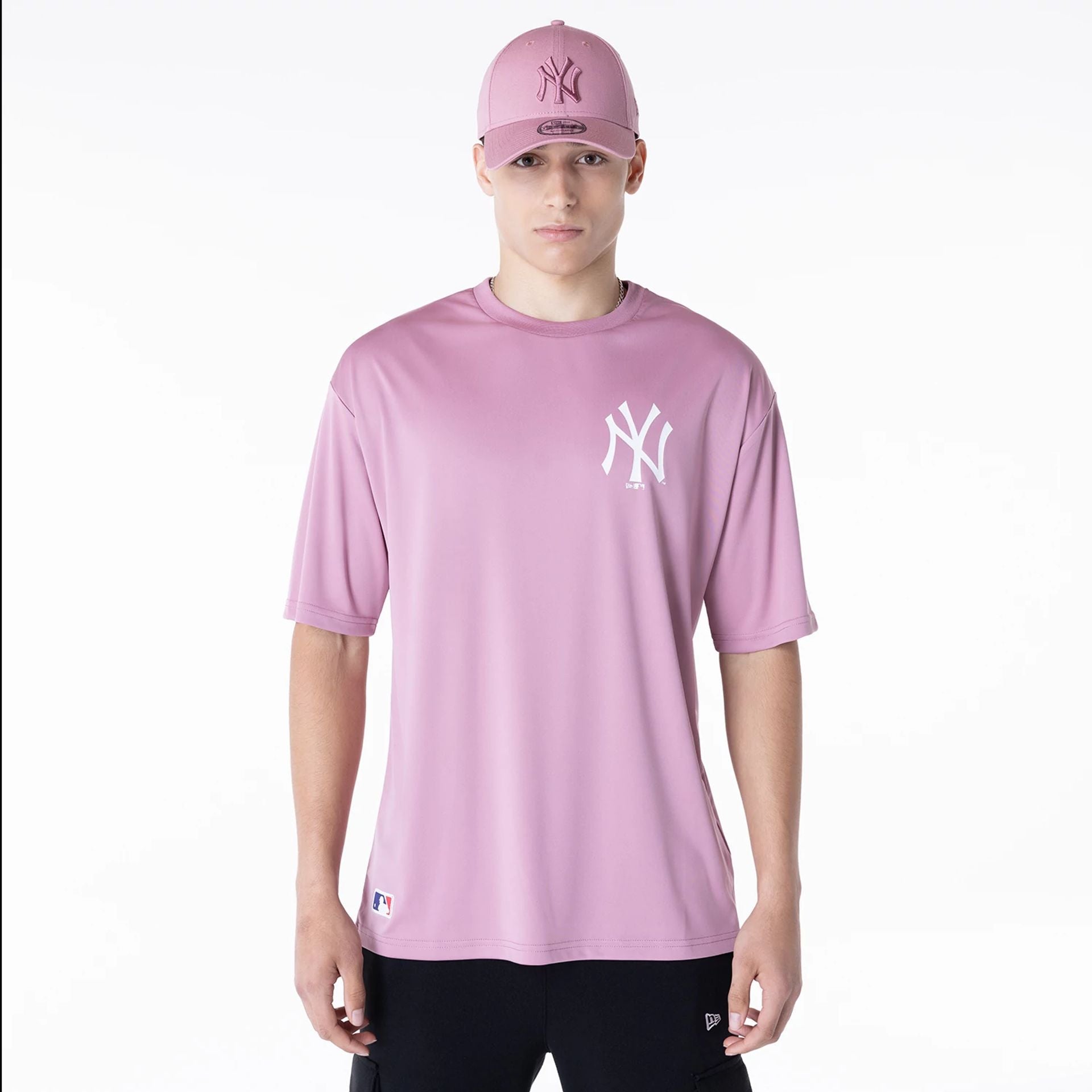 The Male model is wearing New York Yankees League Essential Dark Pink T-Shirt 1