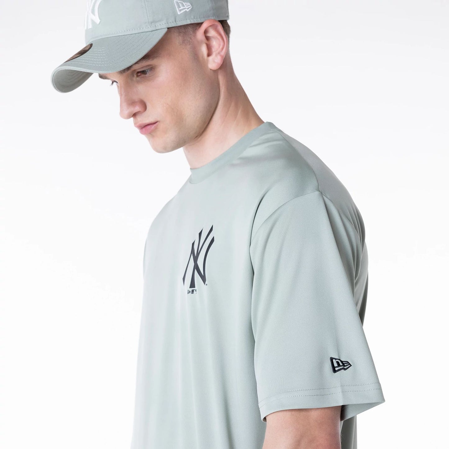 The Male model is wearing New York Yankees League Essential Pastel Green T-Shirt 4