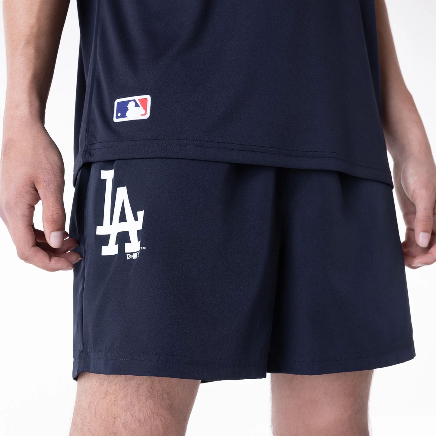 The Male model is wearing LA Dodgers League Essential Navy Shorts 6