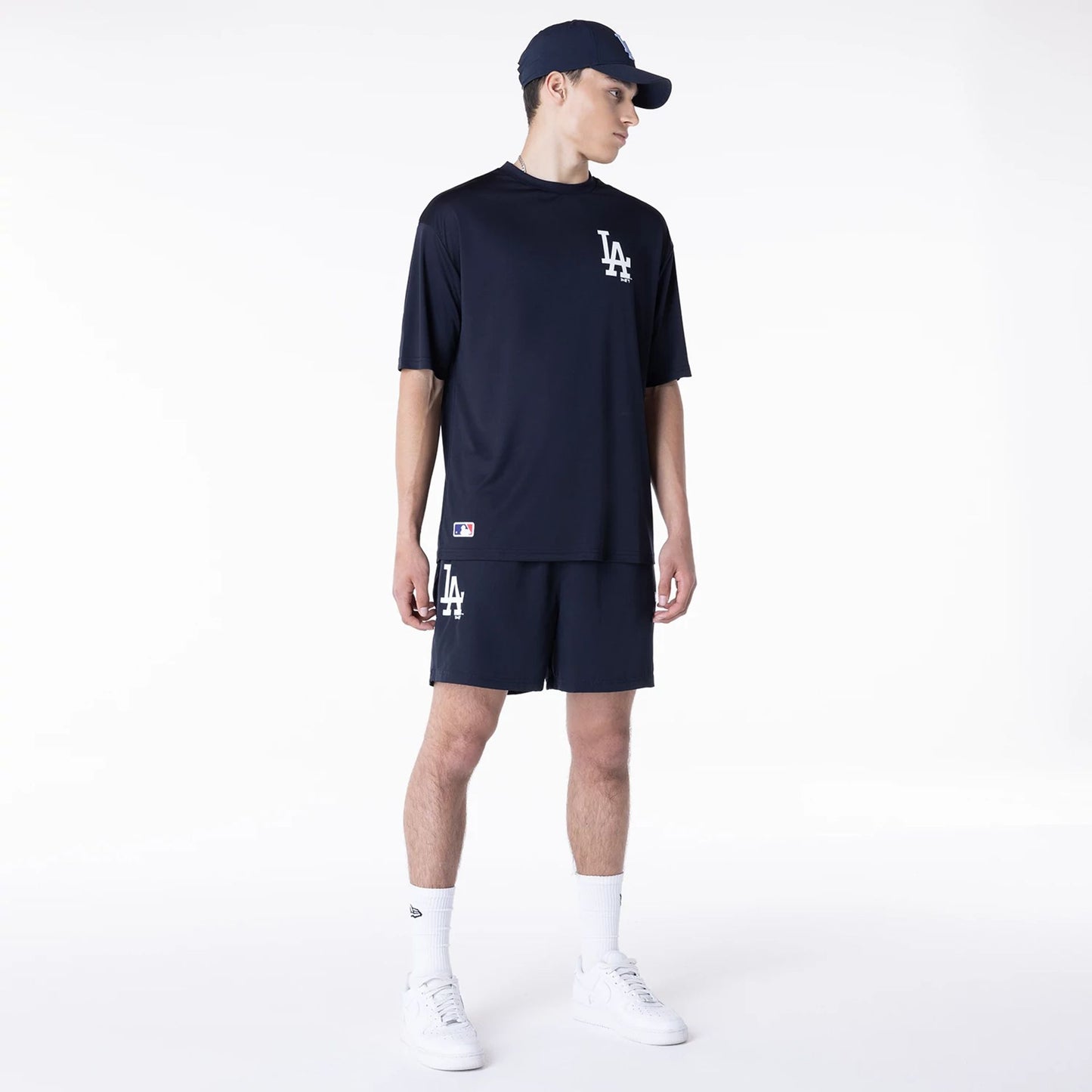 The Male model is wearing LA Dodgers League Essential Navy Shorts 5