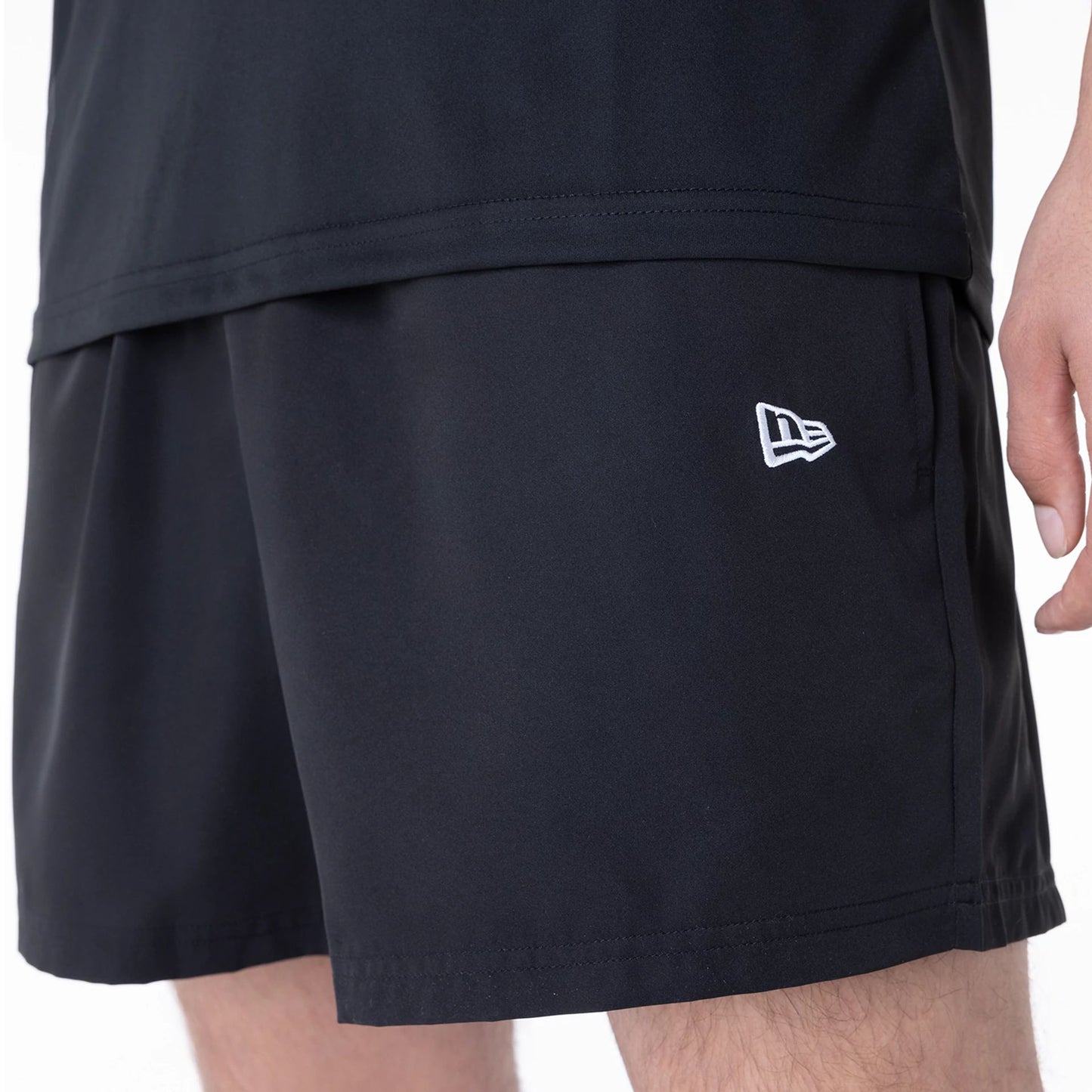 The Male model is wearing New York Yankees League Essential Black Shorts 5