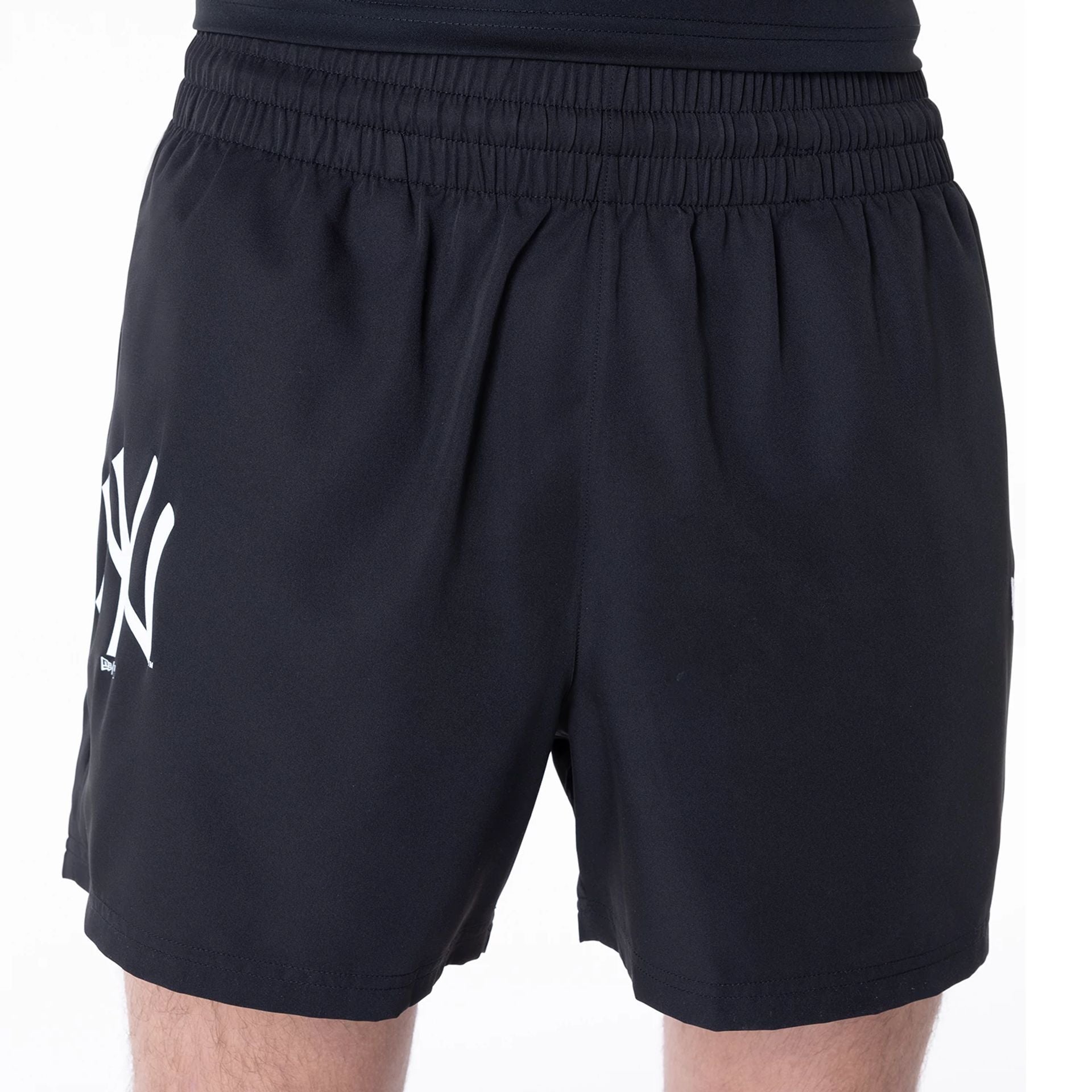 The Male model is wearing New York Yankees League Essential Black Shorts 3