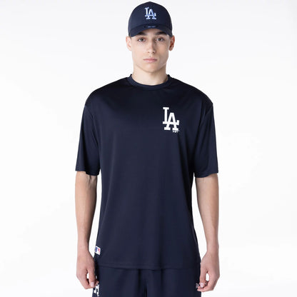 The Male model is wearing LA Dodgers League Essential Navy T-Shirt 1