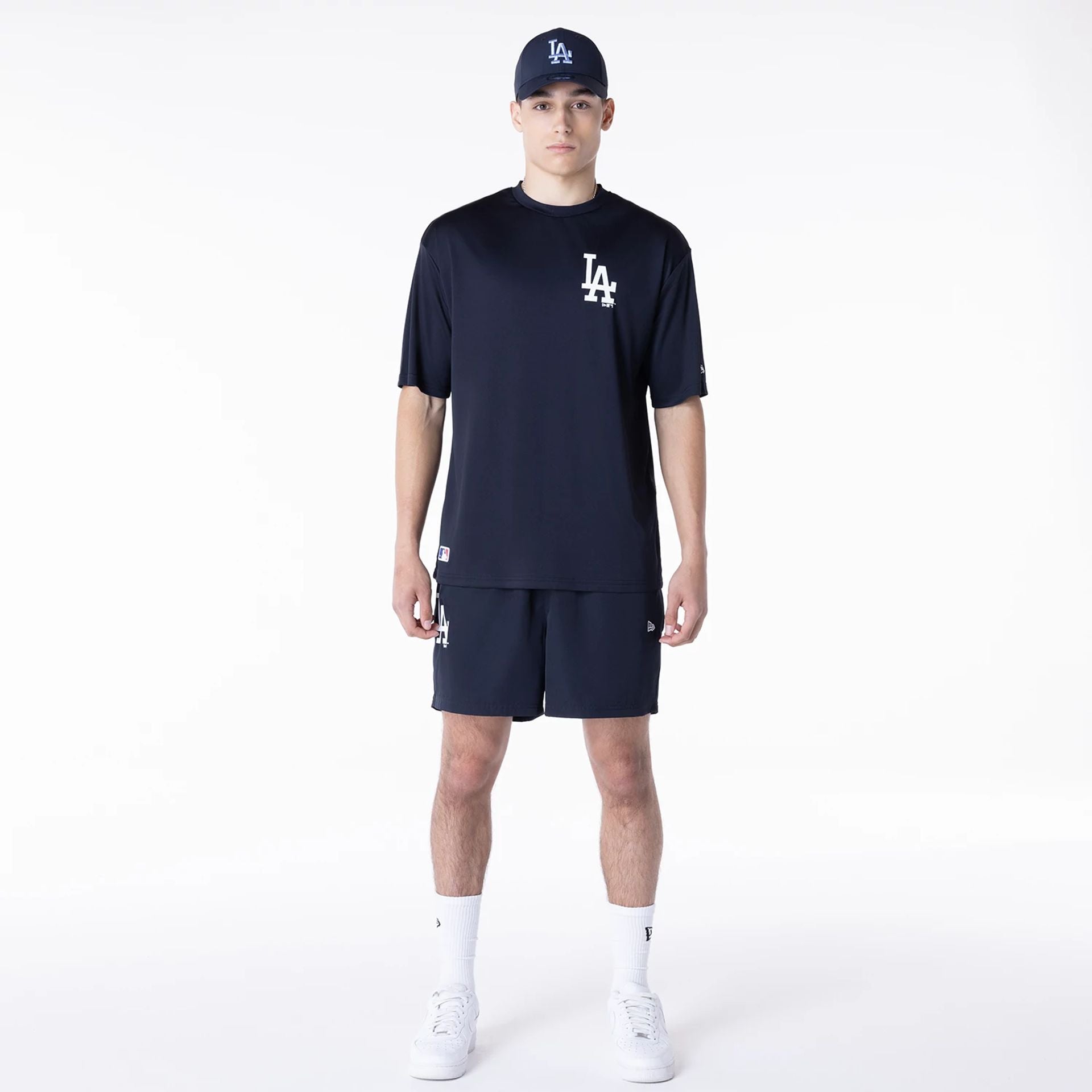 The Male model is wearing LA Dodgers League Essential Navy T-Shirt 3