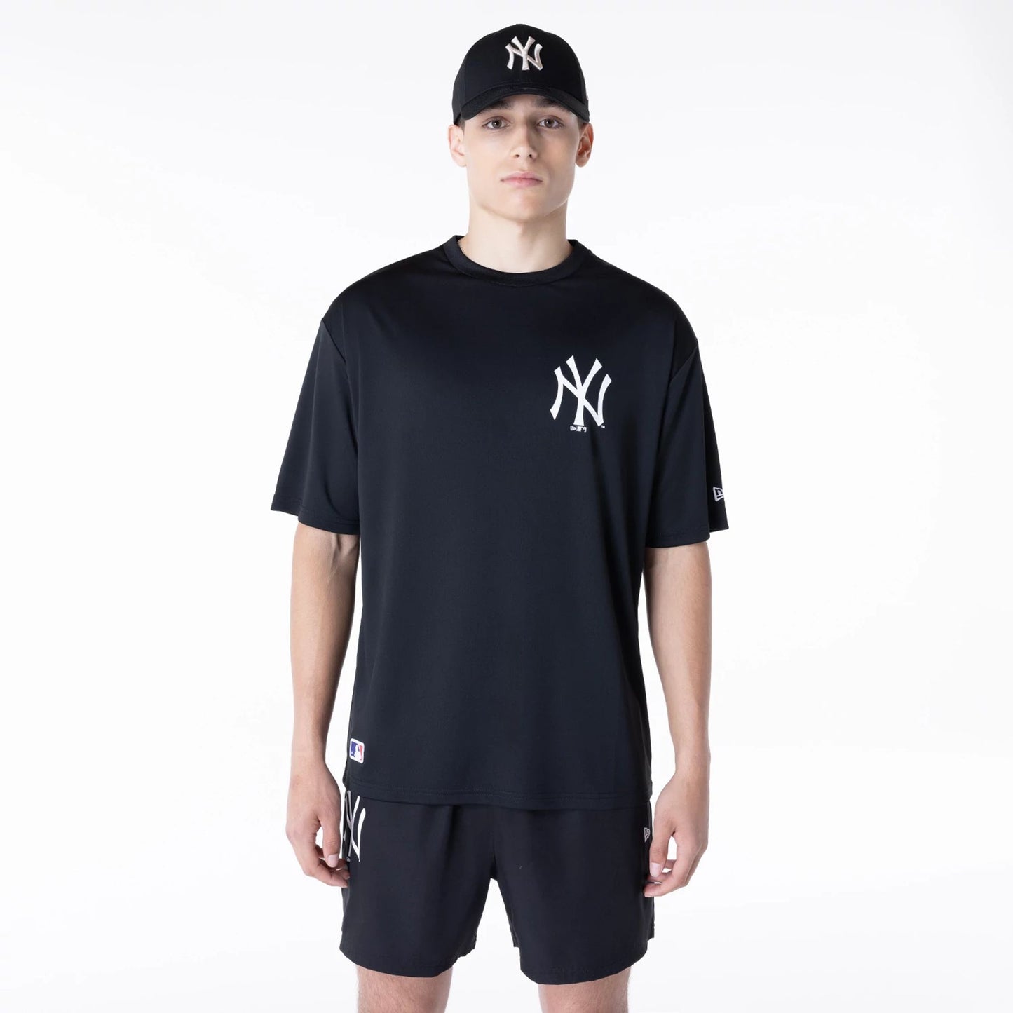 The Male model is wearing New York Yankees League Essential Black T-Shirt 1