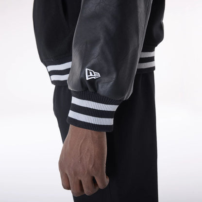 The Male model is wearing Las Vegas Raiders NFL Black Varsity Jacket 6