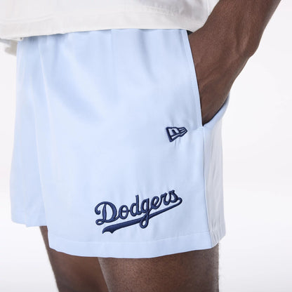 The Male model is wearing LA Dodgers MLB Woven Pastel Blue Shorts 4