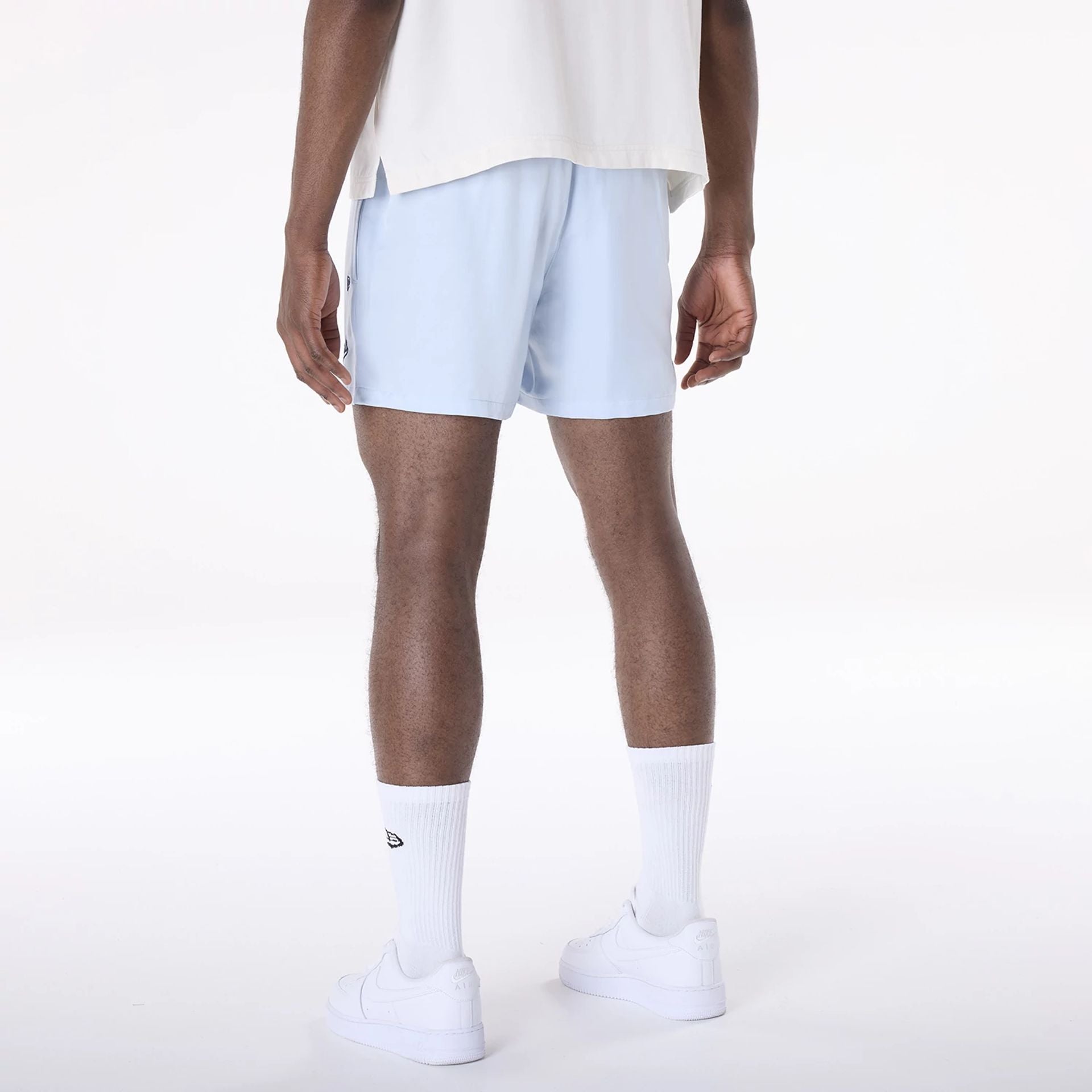 The Male model is wearing LA Dodgers MLB Woven Pastel Blue Shorts 2