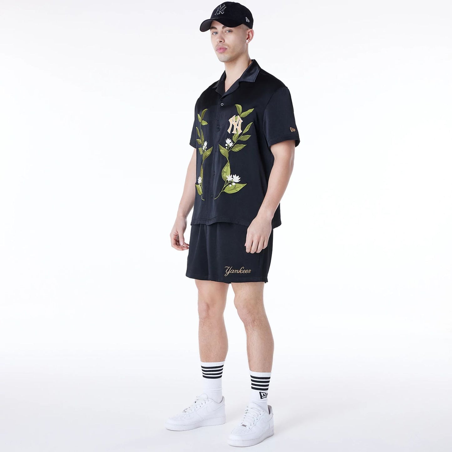 The Male model is wearing New York Yankees Floral Revere Black Short Sleeve Shirt 4