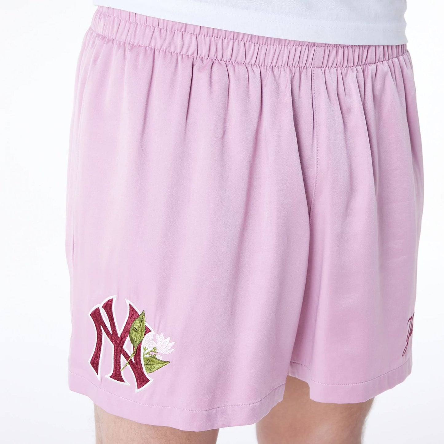 The Male model is wearing New York Yankees MLB Woven Dark Pink Shorts 4