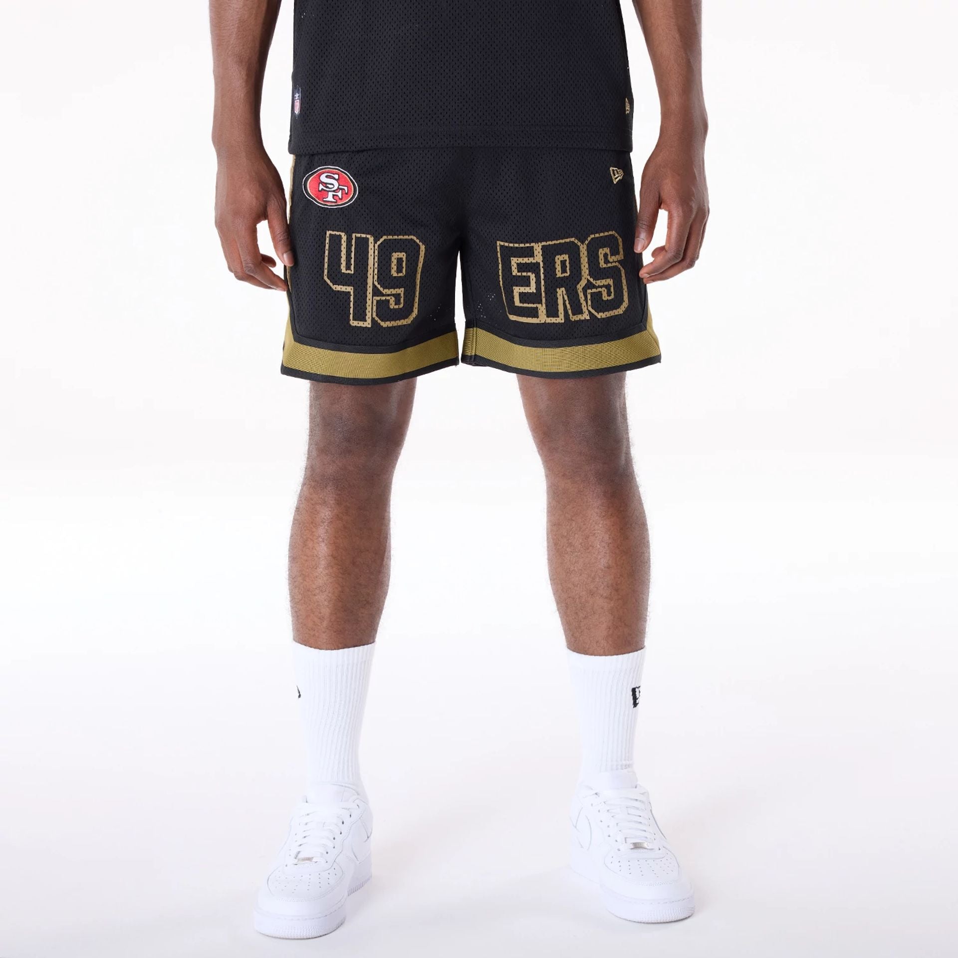 The Male model is wearing San Francisco 49ers NFL Mesh Black Shorts 1