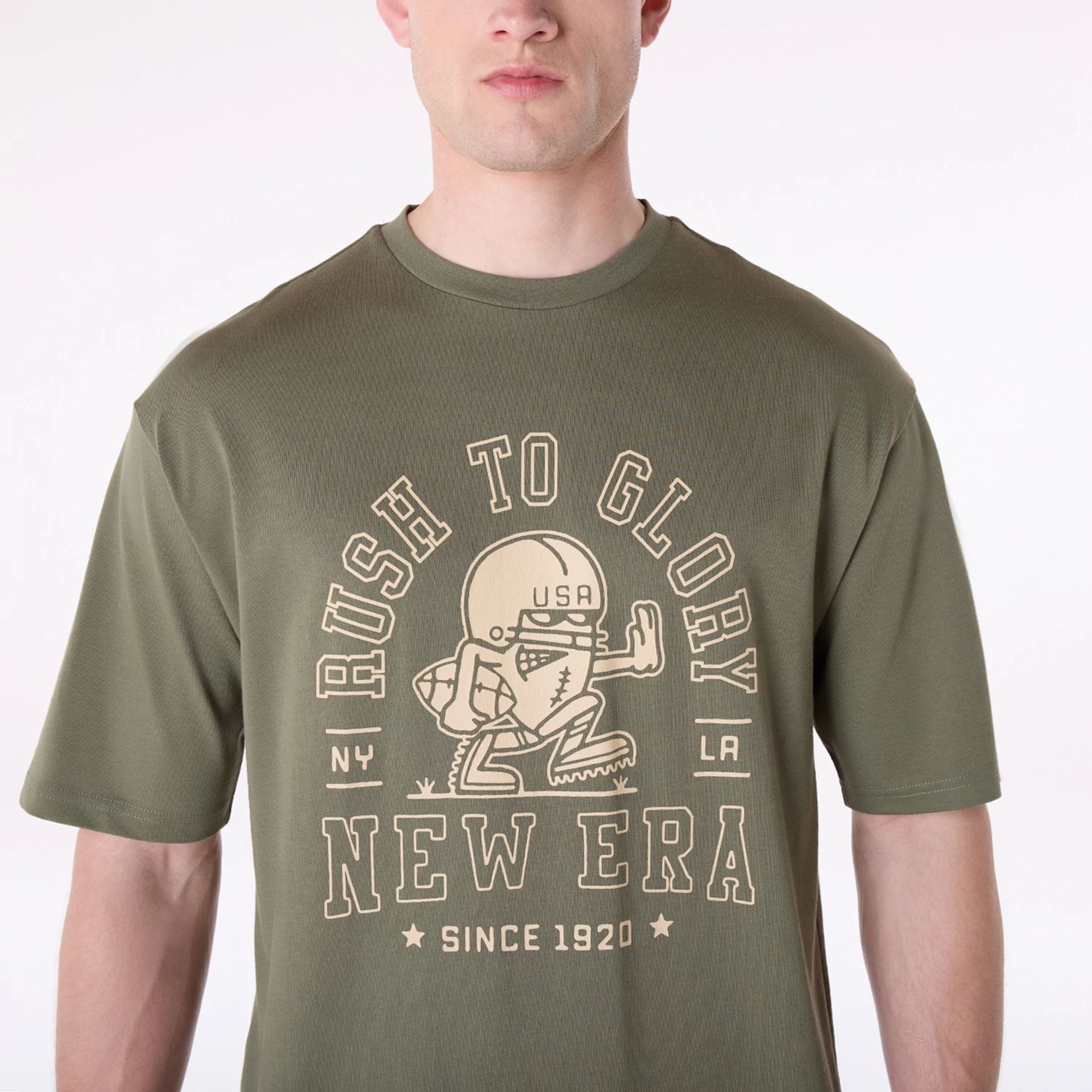 The Male model is wearing New Era Football Graphic Green T-Shirt 5