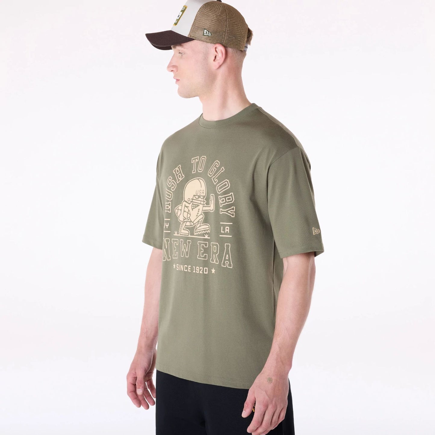 The Male model is wearing New Era Football Graphic Green T-Shirt 3