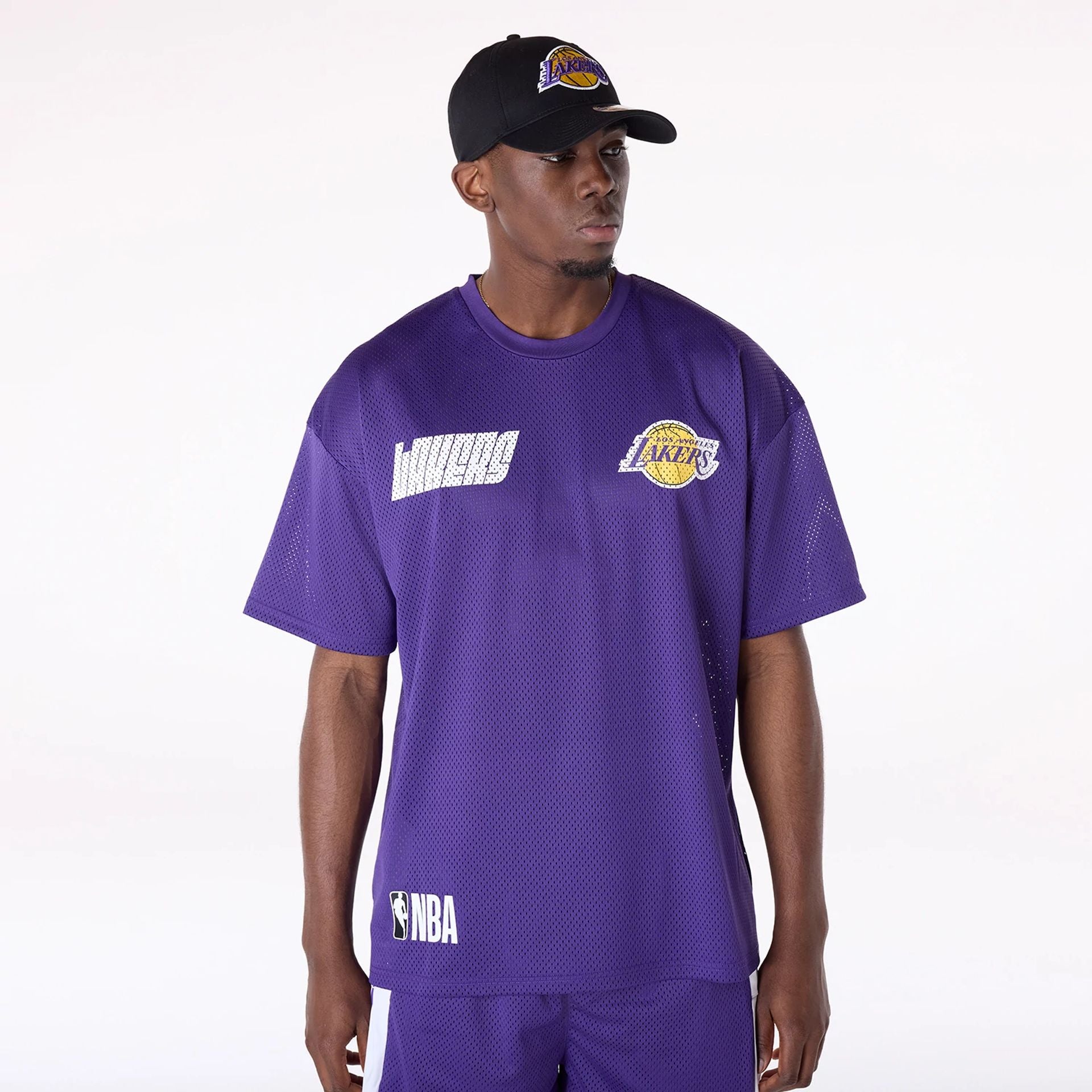 The Male model is wearing LA Lakers NBA Graphic Purple Mesh T-Shirt 1