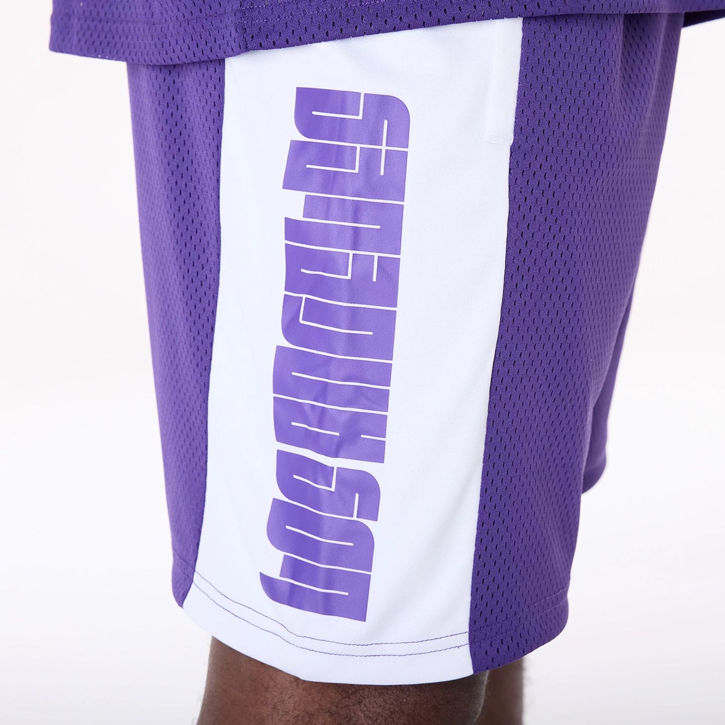 The Male model is wearing LA Lakers NBA Graphic Purple Mesh Shorts 3