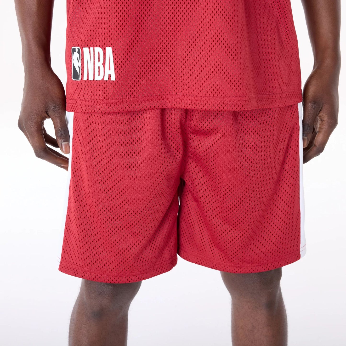 The Male model is wearing Miami Heat NBA Graphic Dark Red Mesh Shorts 2