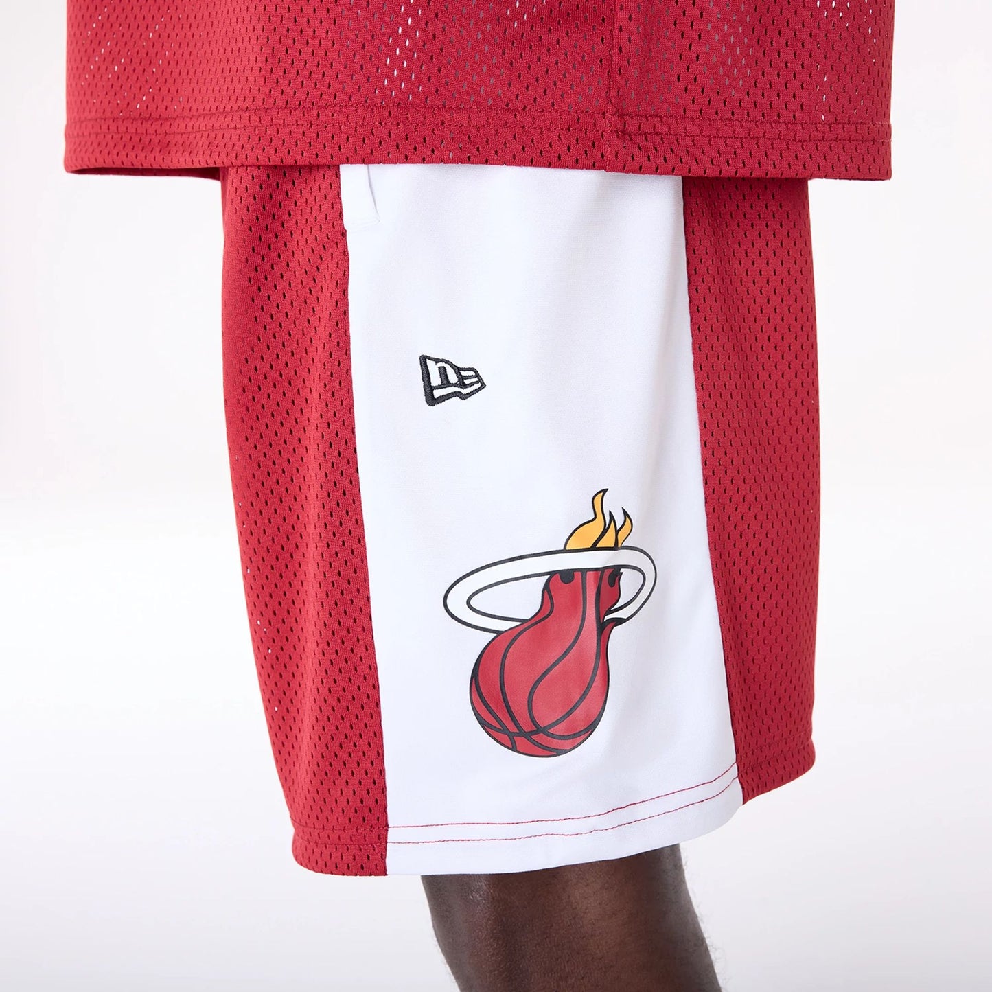 The Male model is wearing Miami Heat NBA Graphic Dark Red Mesh Shorts 4