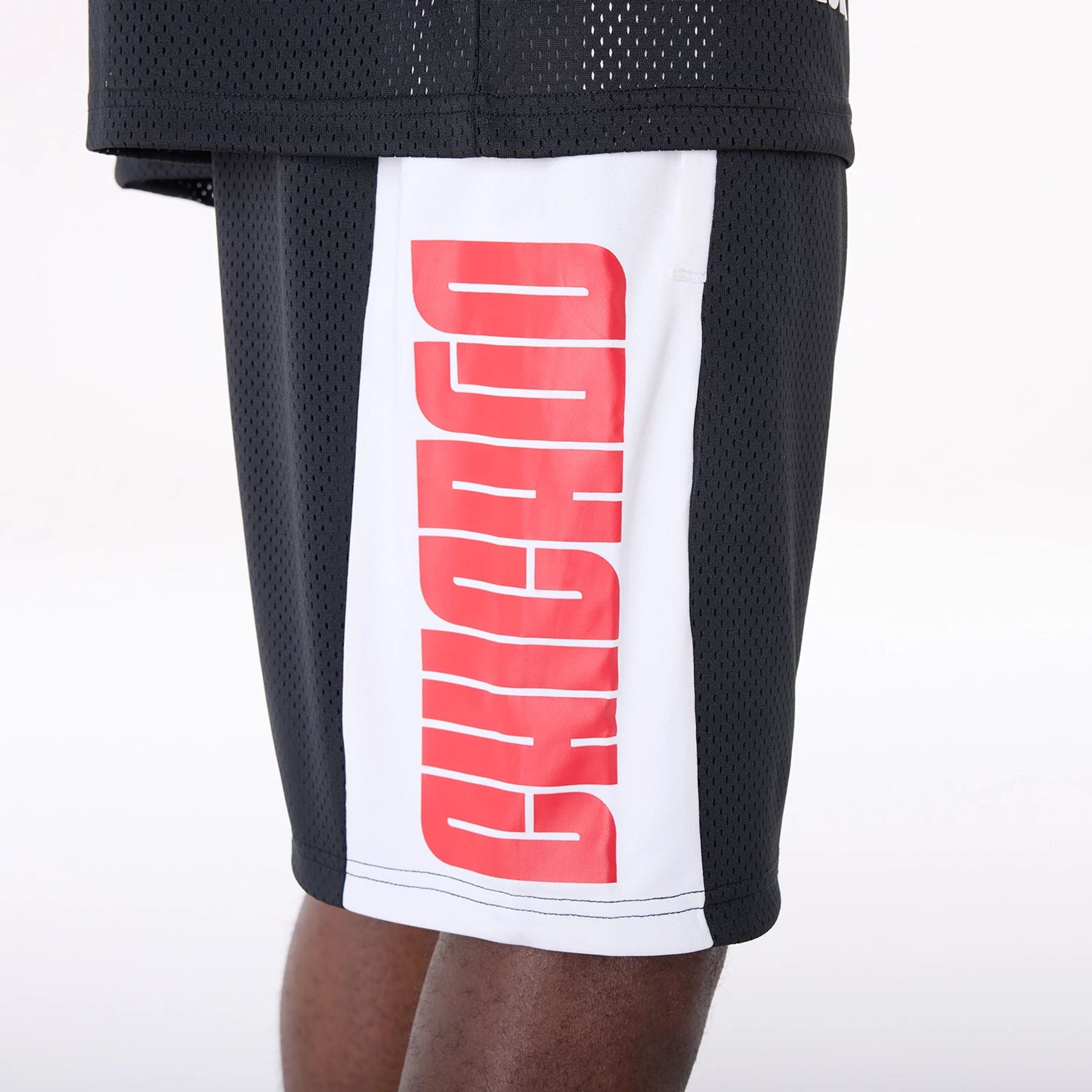 The Male model is wearing Chicago Bulls NBA Graphic Black Mesh Shorts 3