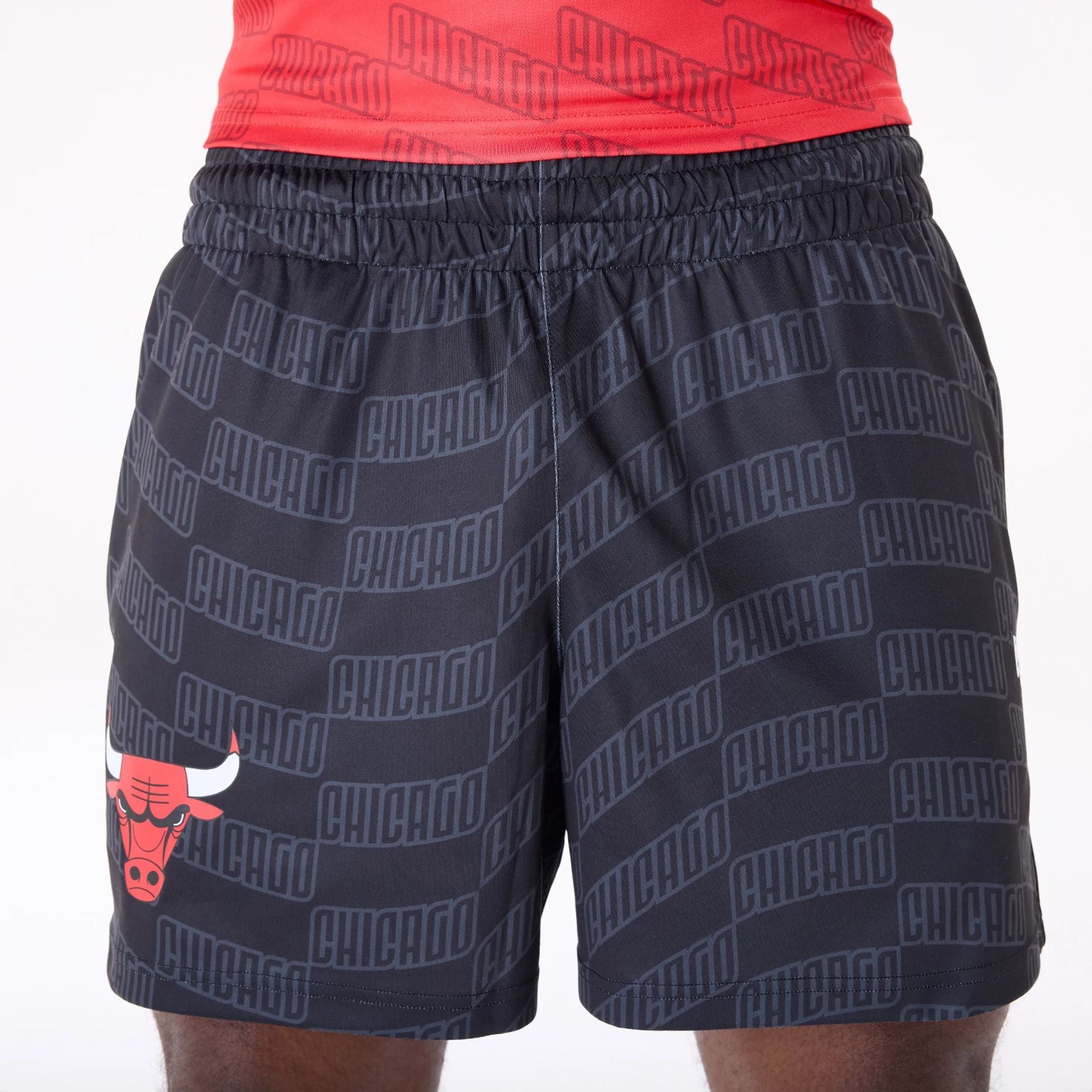 The Male model is wearing Chicago Bulls NBA All Over Print Graphic Black Shorts 7