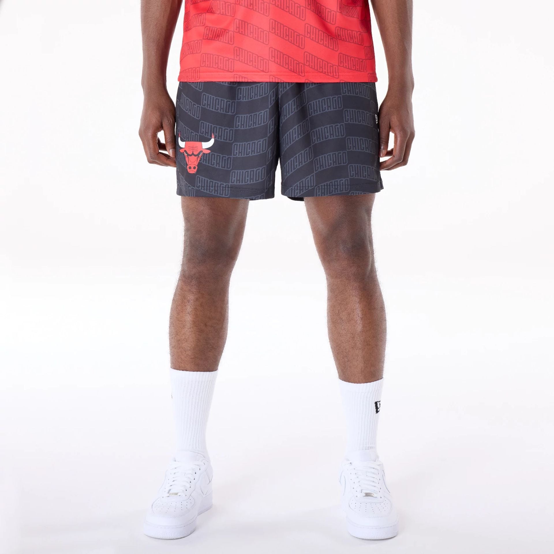 The Male model is wearing Chicago Bulls NBA All Over Print Graphic Black Shorts 1