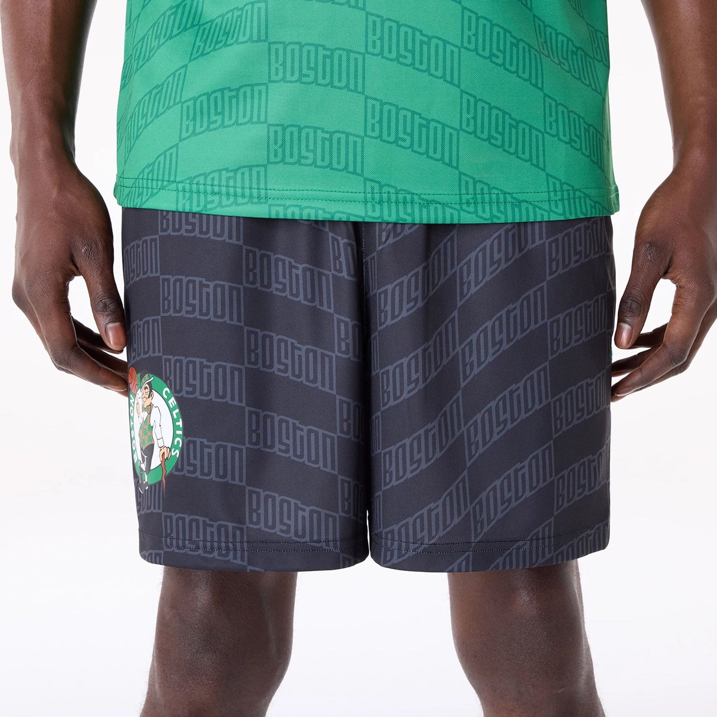 The Male model is wearing Boston Celtics NBA All Over Print Graphic Black Shorts 2