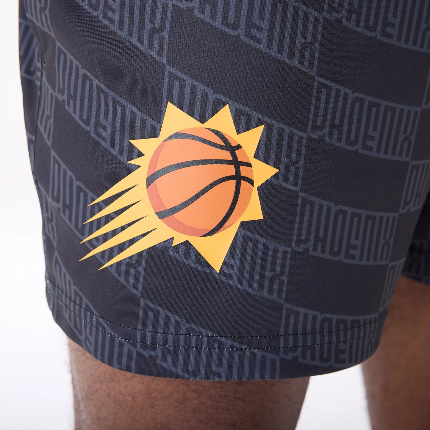 The Male model is wearing Phoenix Suns NBA All Over Print Graphic Black Shorts 8