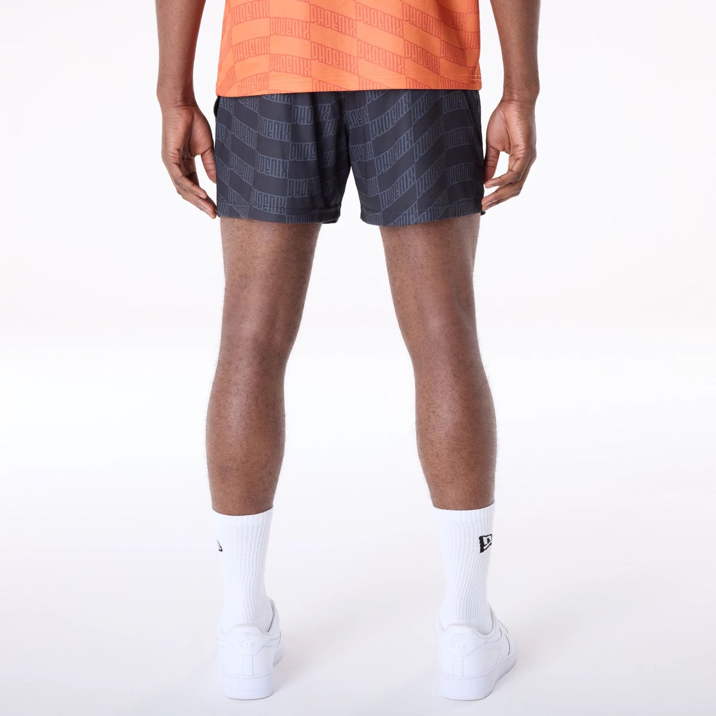 The Male model is wearing Phoenix Suns NBA All Over Print Graphic Black Shorts 3