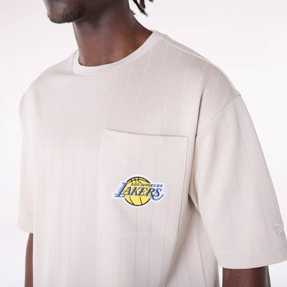 The Male model is wearing LA Lakers NBA Pinstripe Cream Oversized T-Shirt 7