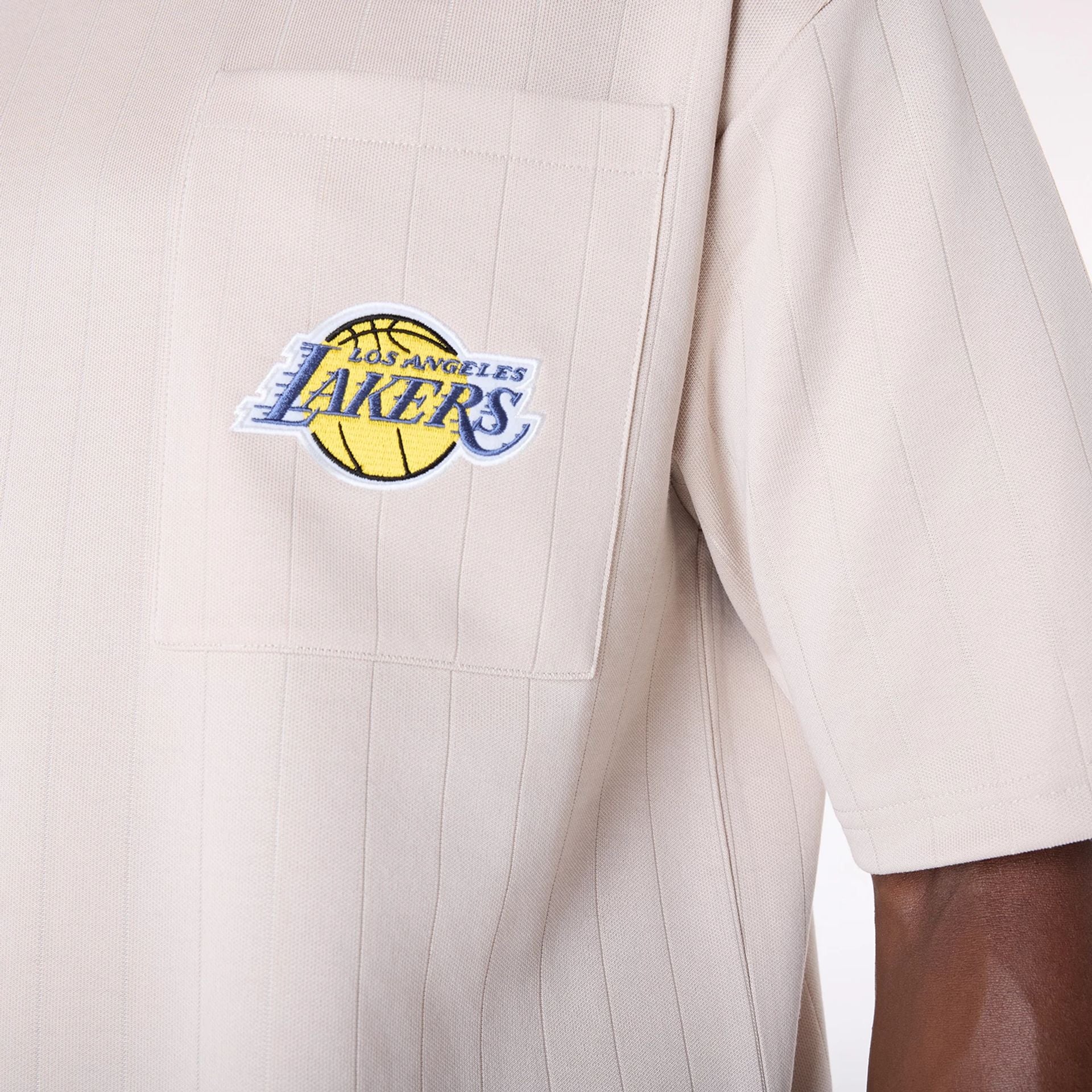 The Male model is wearing LA Lakers NBA Pinstripe Cream Oversized T-Shirt 6