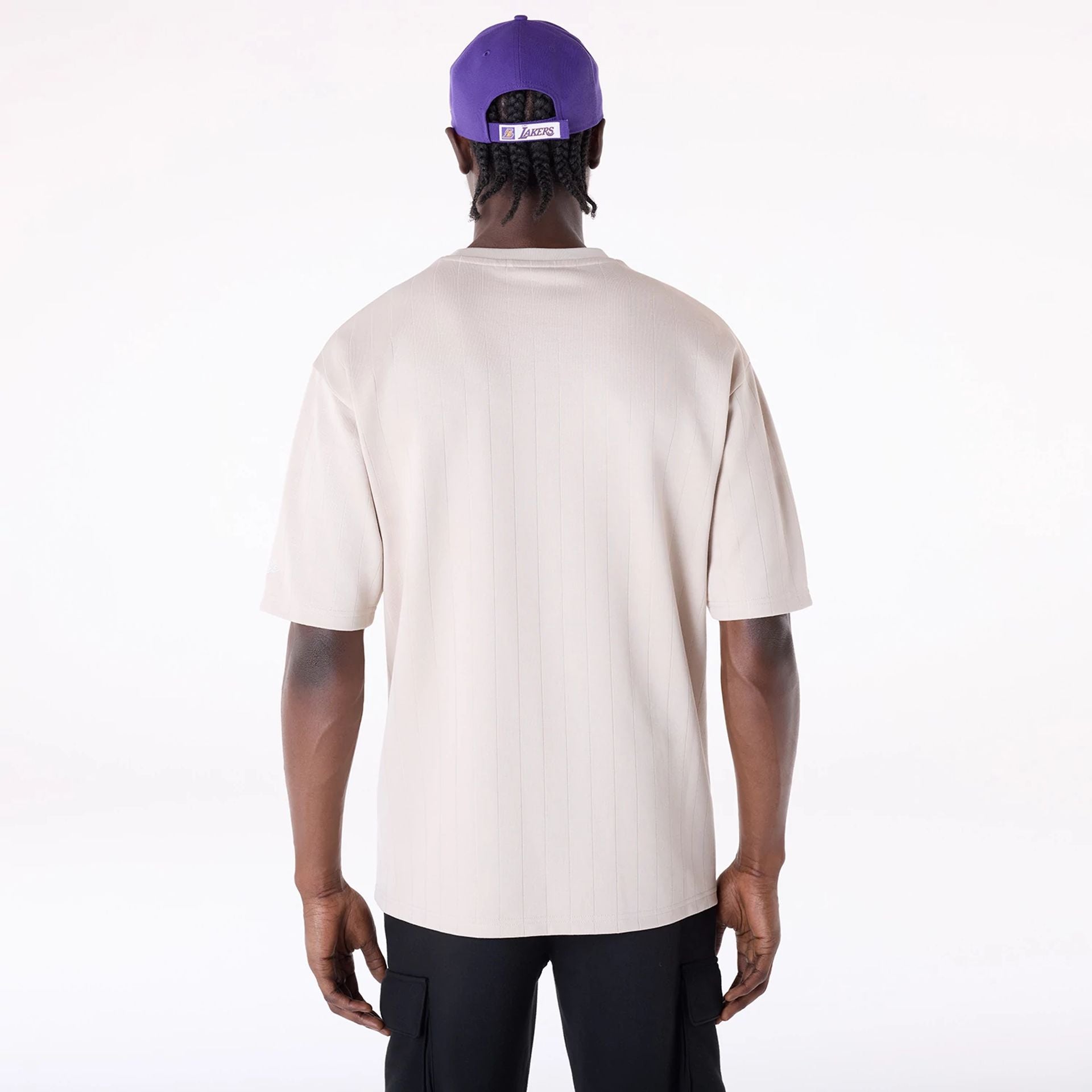 The Male model is wearing LA Lakers NBA Pinstripe Cream Oversized T-Shirt 2