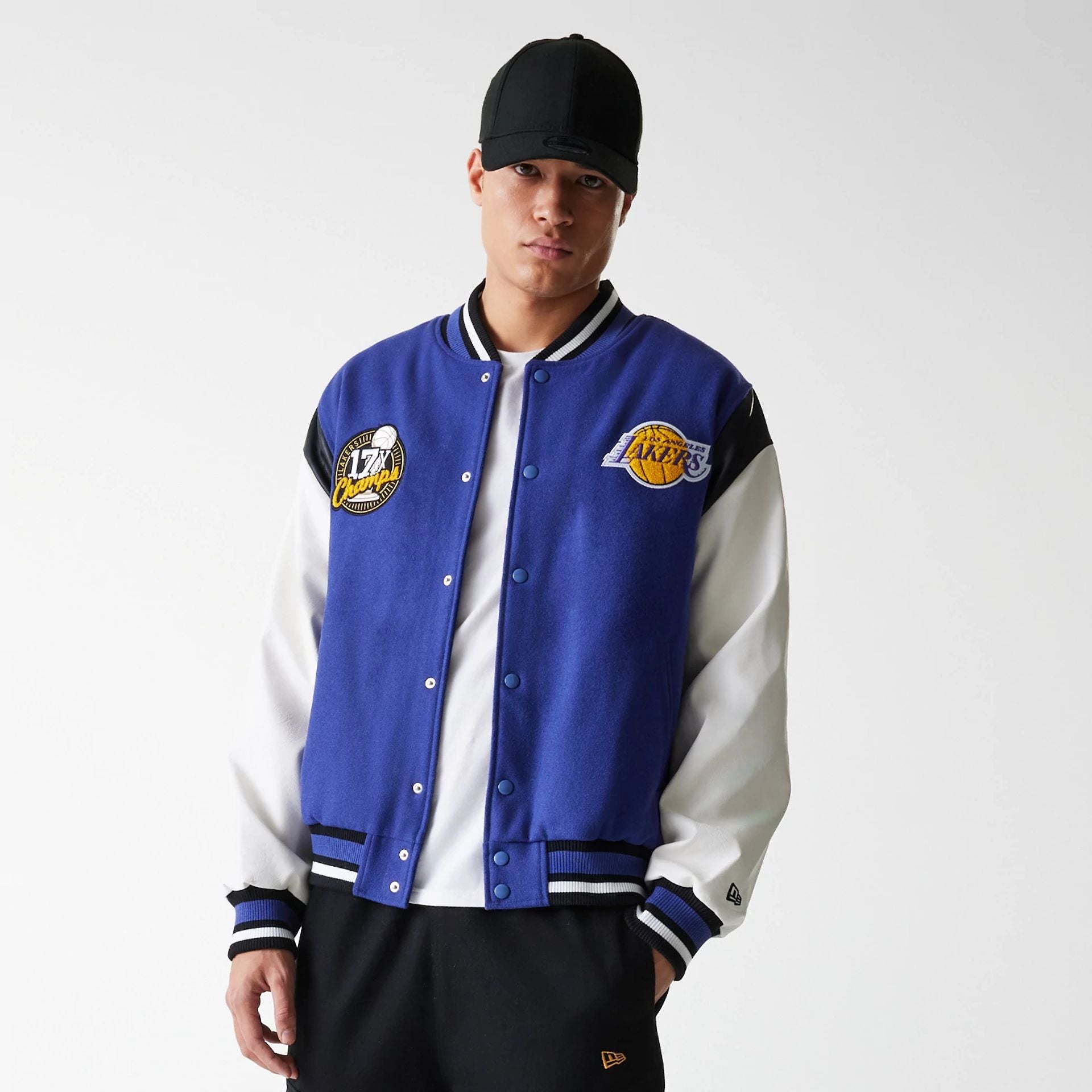 The Male model is wearing LA Lakers NBA Floral Dark Blue Varsity Jacket 7