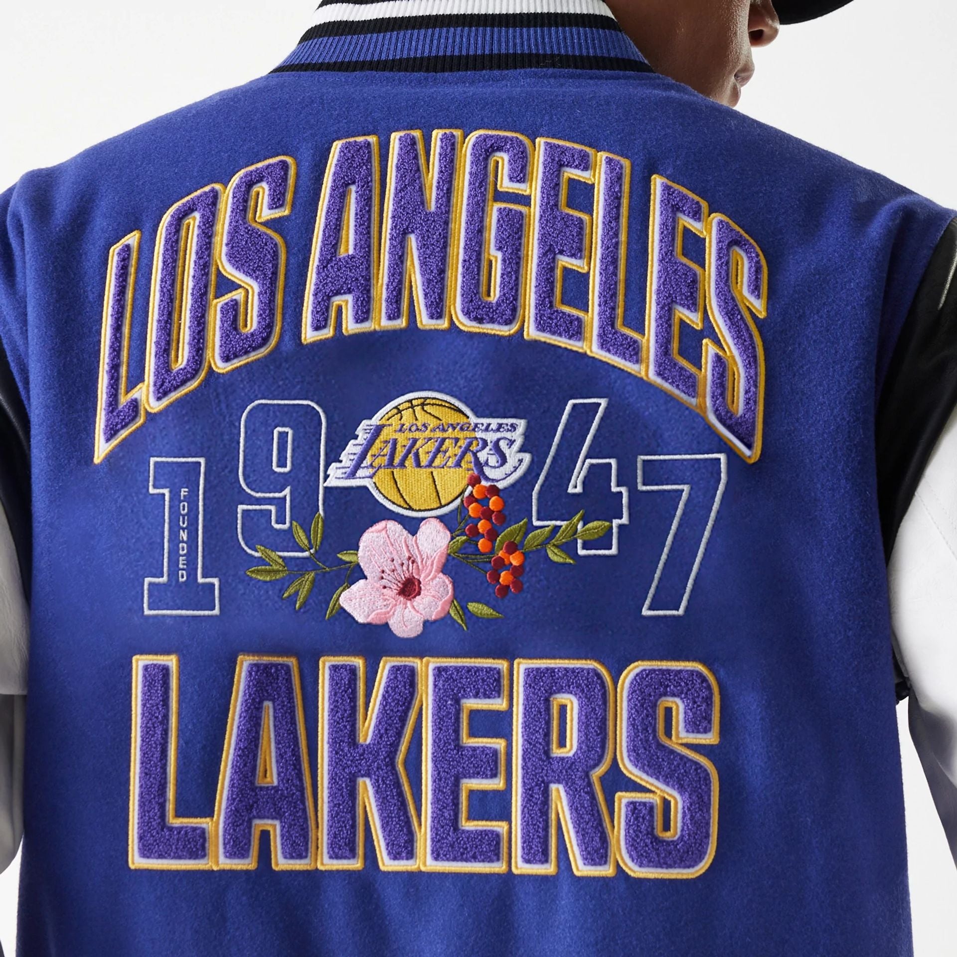 The Male model is wearing LA Lakers NBA Floral Dark Blue Varsity Jacket 6