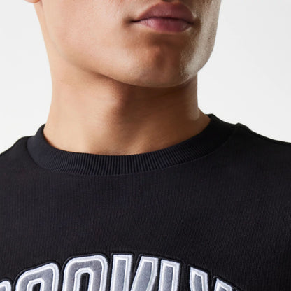 The Male model is wearing Brooklyn Nets NBA Floral Black Oversized Crew Neck Sweater 7