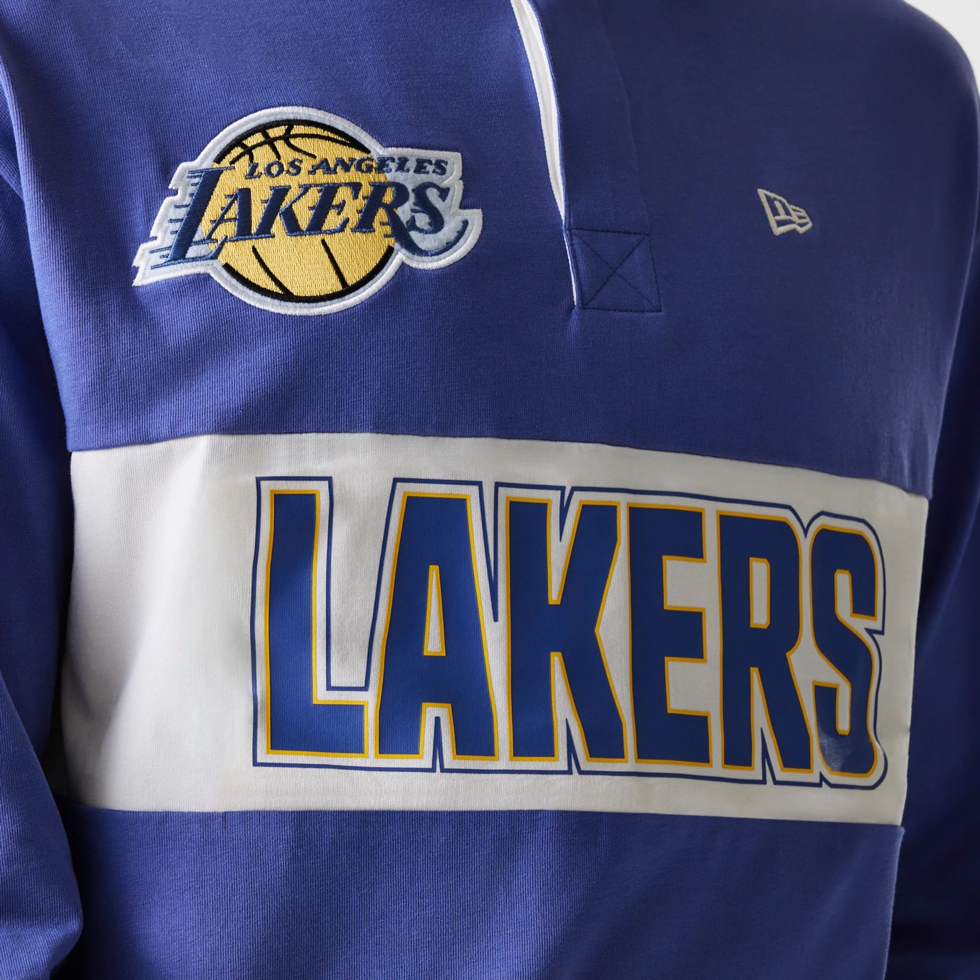 The Male model is wearing LA Lakers NBA Rugby Dark Blue Long Sleeve Polo 3