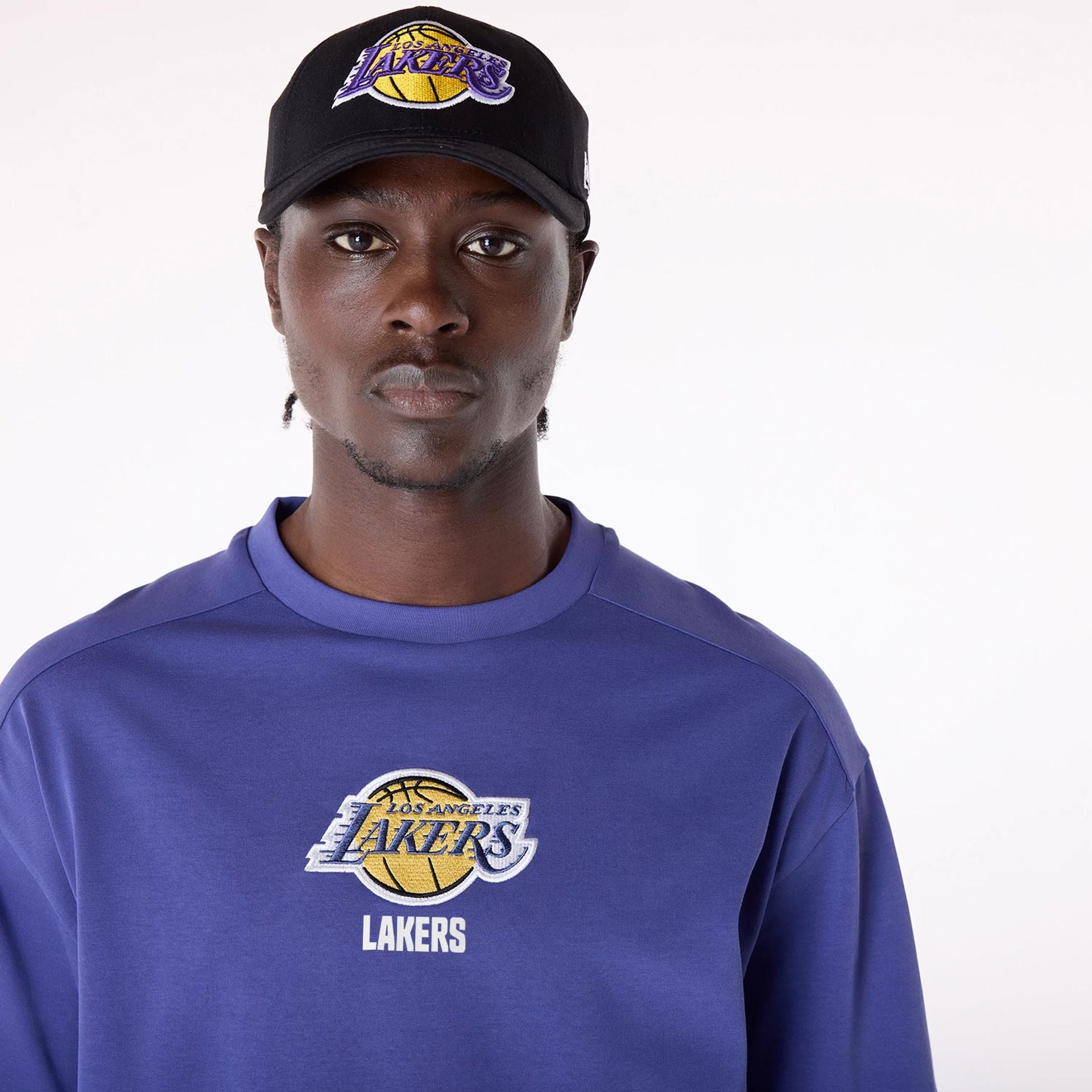 The Male model is wearing LA Lakers NBA Wordmark Dark Blue Oversized T-Shirt 7