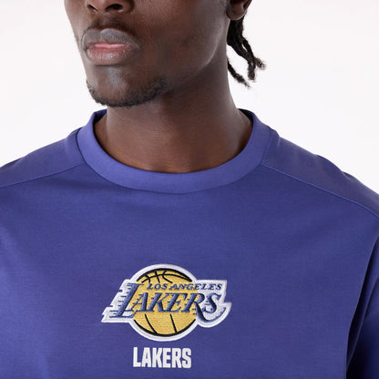 The Male model is wearing LA Lakers NBA Wordmark Dark Blue Oversized T-Shirt 4