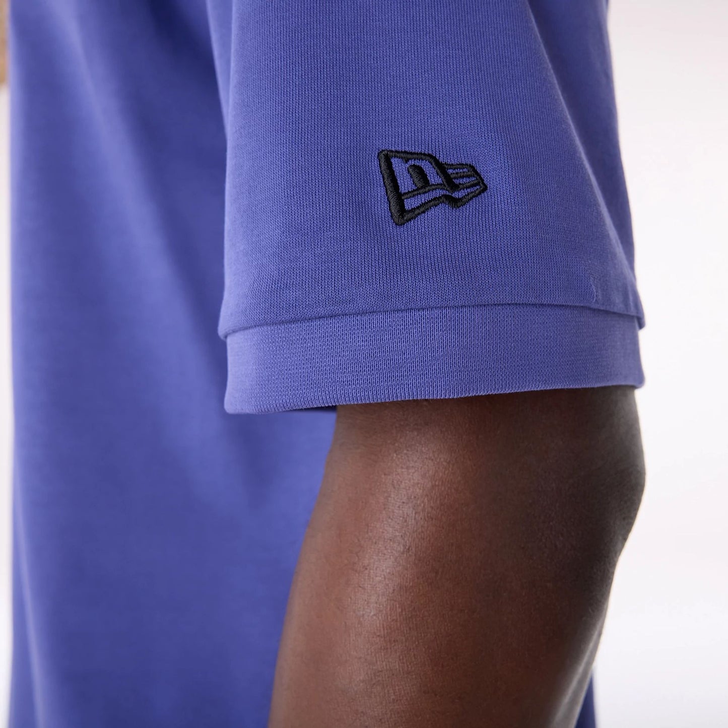 The Male model is wearing LA Lakers NBA Wordmark Dark Blue Oversized T-Shirt 3