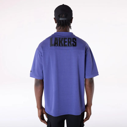 The Male model is wearing LA Lakers NBA Wordmark Dark Blue Oversized T-Shirt 2