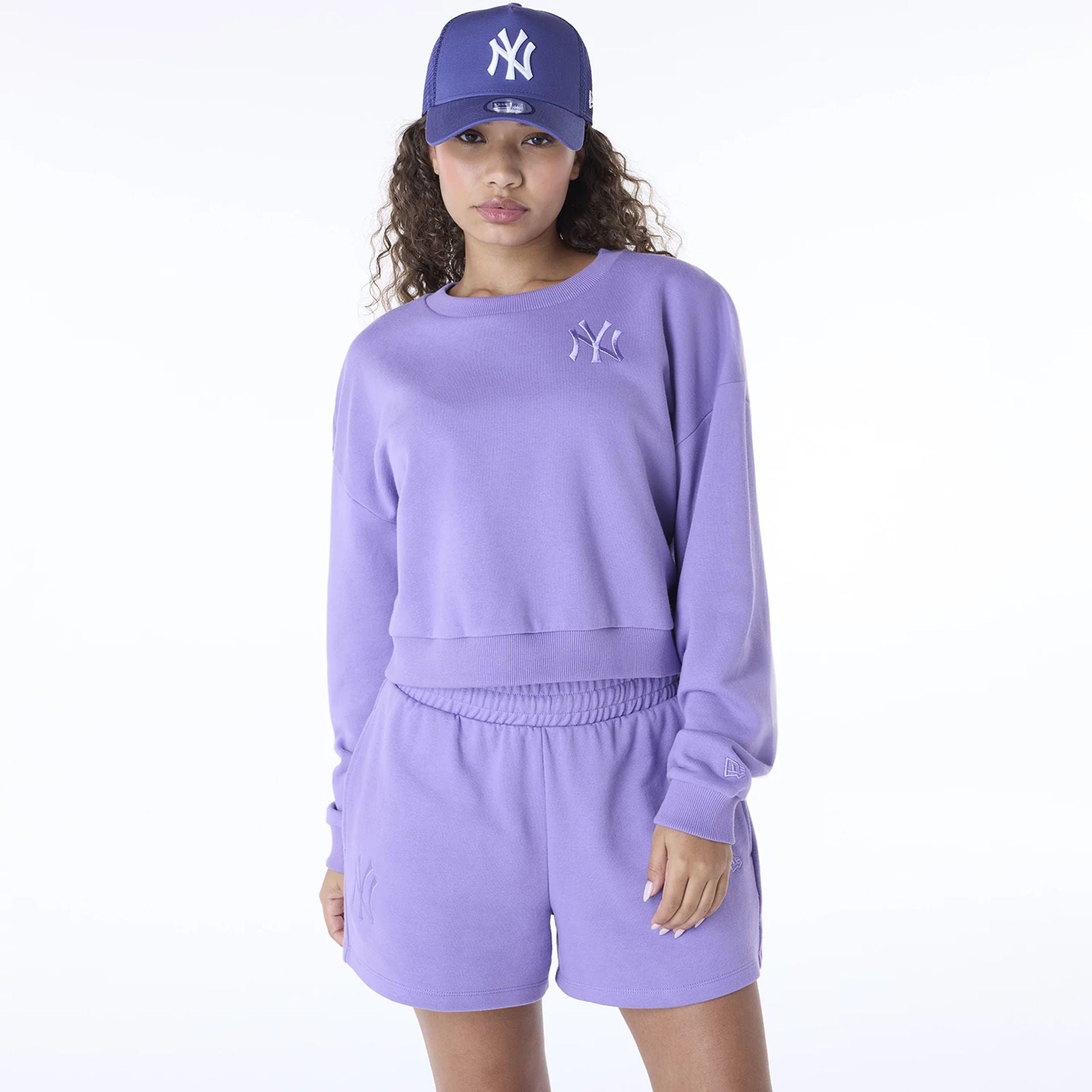 The Female model is wearing New York Yankees Womens MLB League Essential Purple Crew Neck Sweater 1