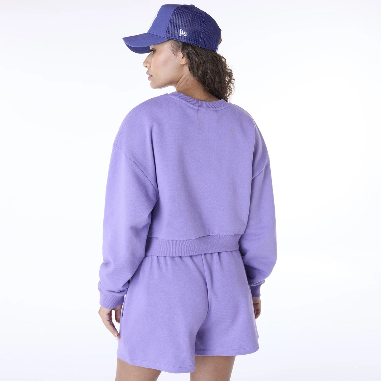 The Female model is wearing New York Yankees Womens MLB League Essential Purple Crew Neck Sweater 4