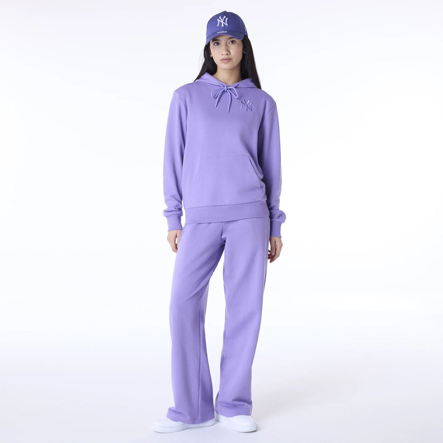 The Female model is wearing New York Yankees Womens MLB League Essential Purple Pullover Hoodie 3