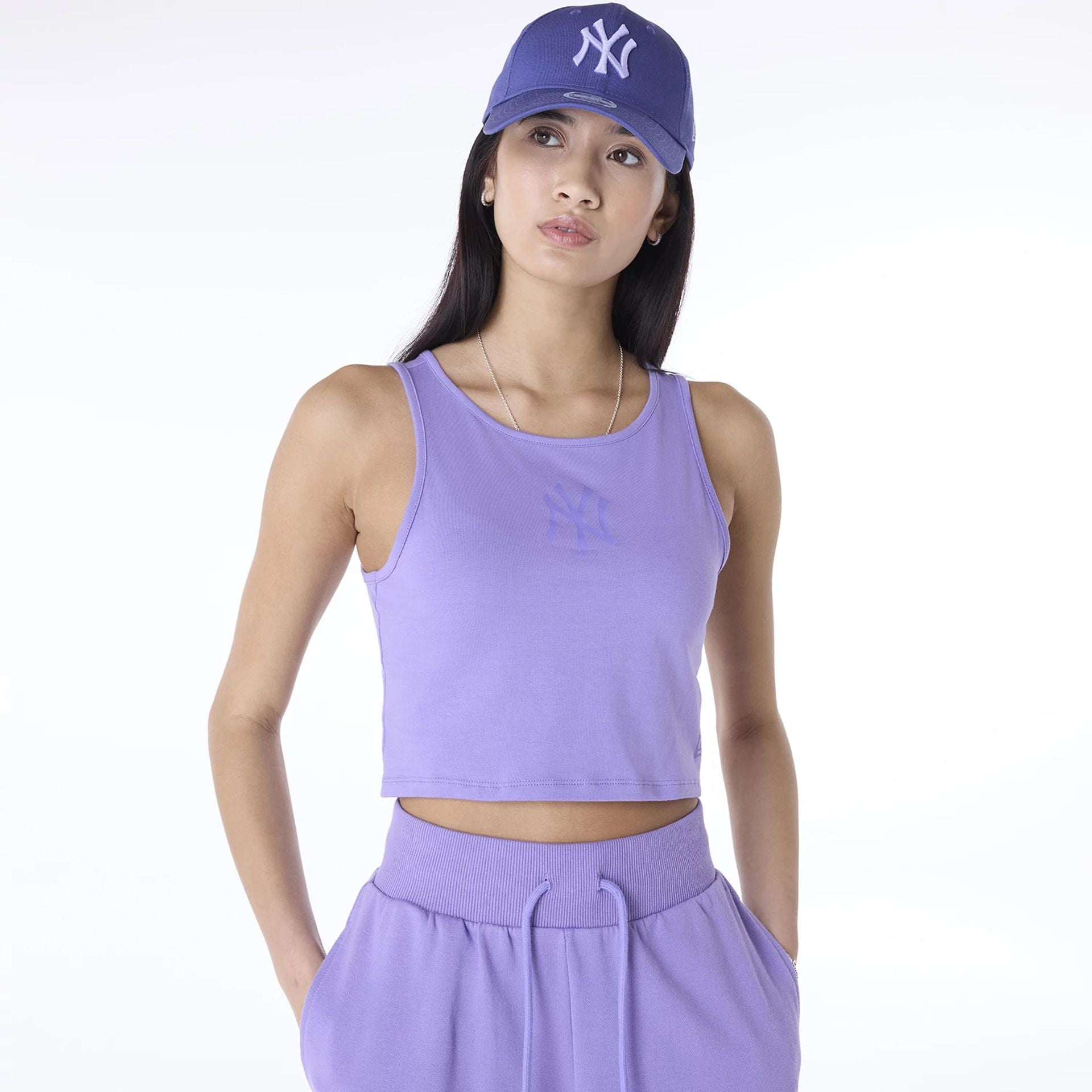 The Female model is wearing New York Yankees Womens MLB League Essential Purple Vest 2